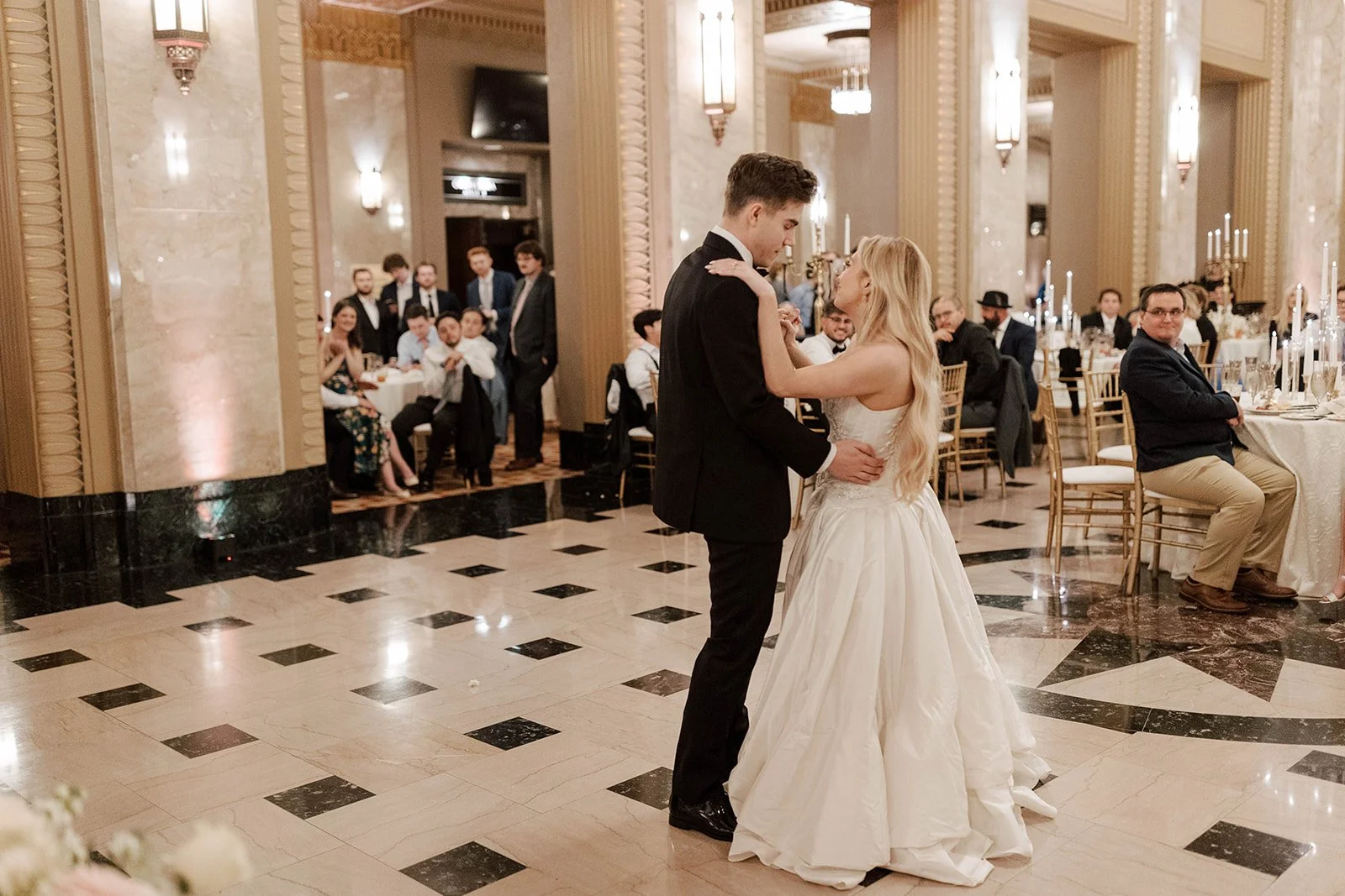 Emma and Max sharing their first dance at the Stifel Theatre