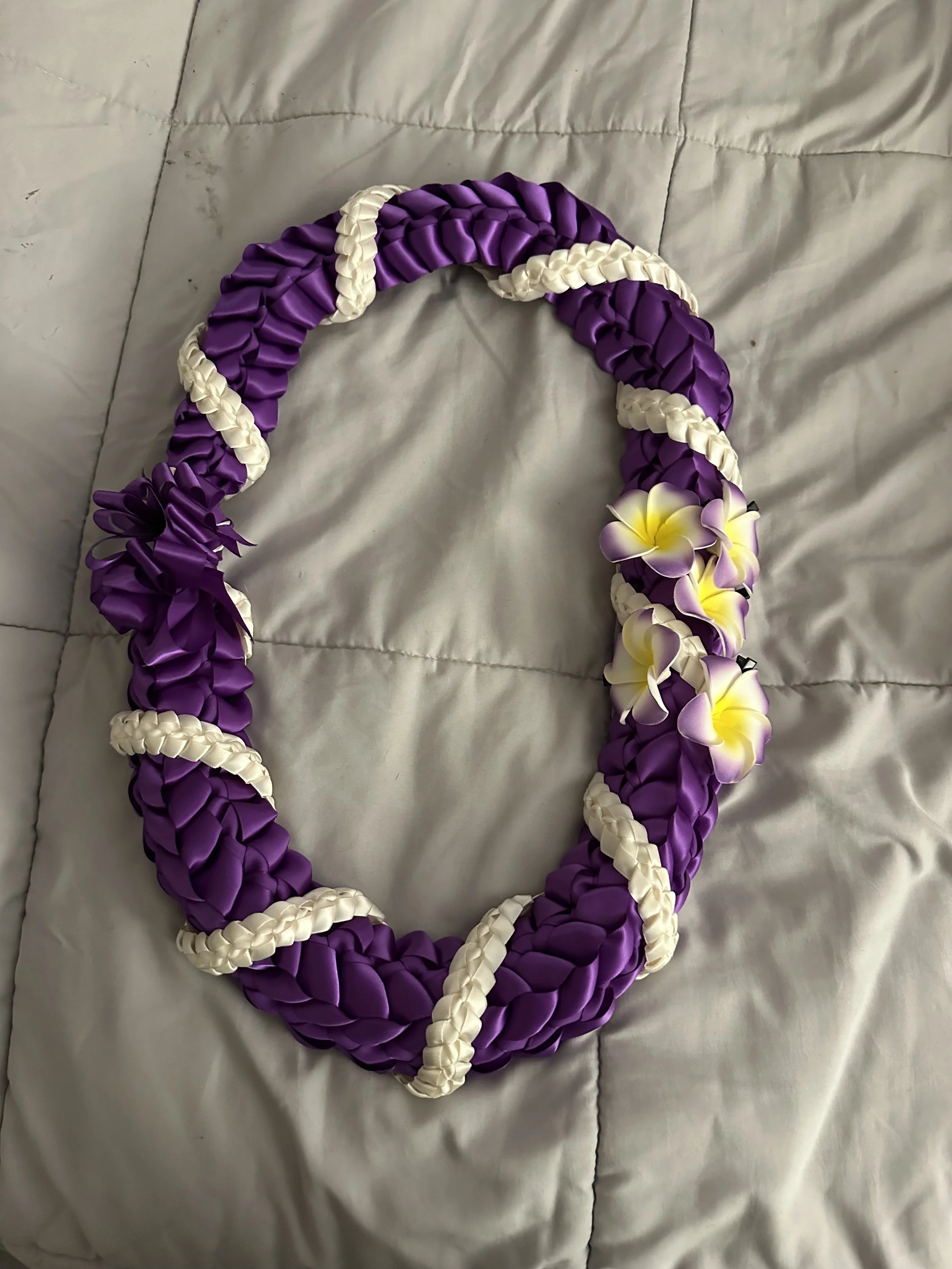 Twist with plumeria flowers $50.00