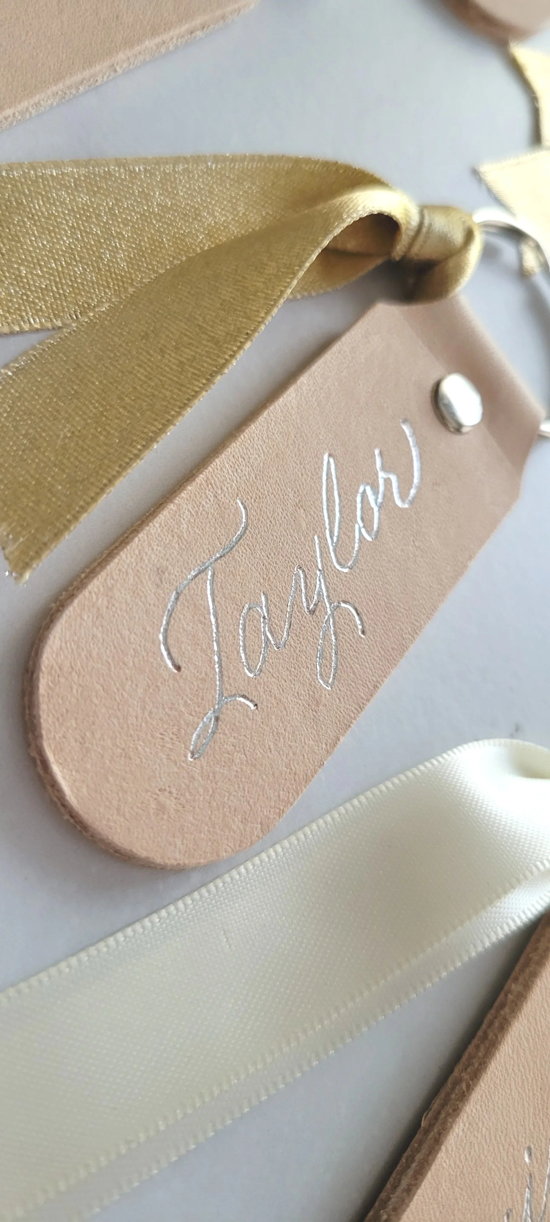 oklahoma_city_calligrapher_letter10_design_hot_foiled_leather_keychains-wedding_favors.jpg