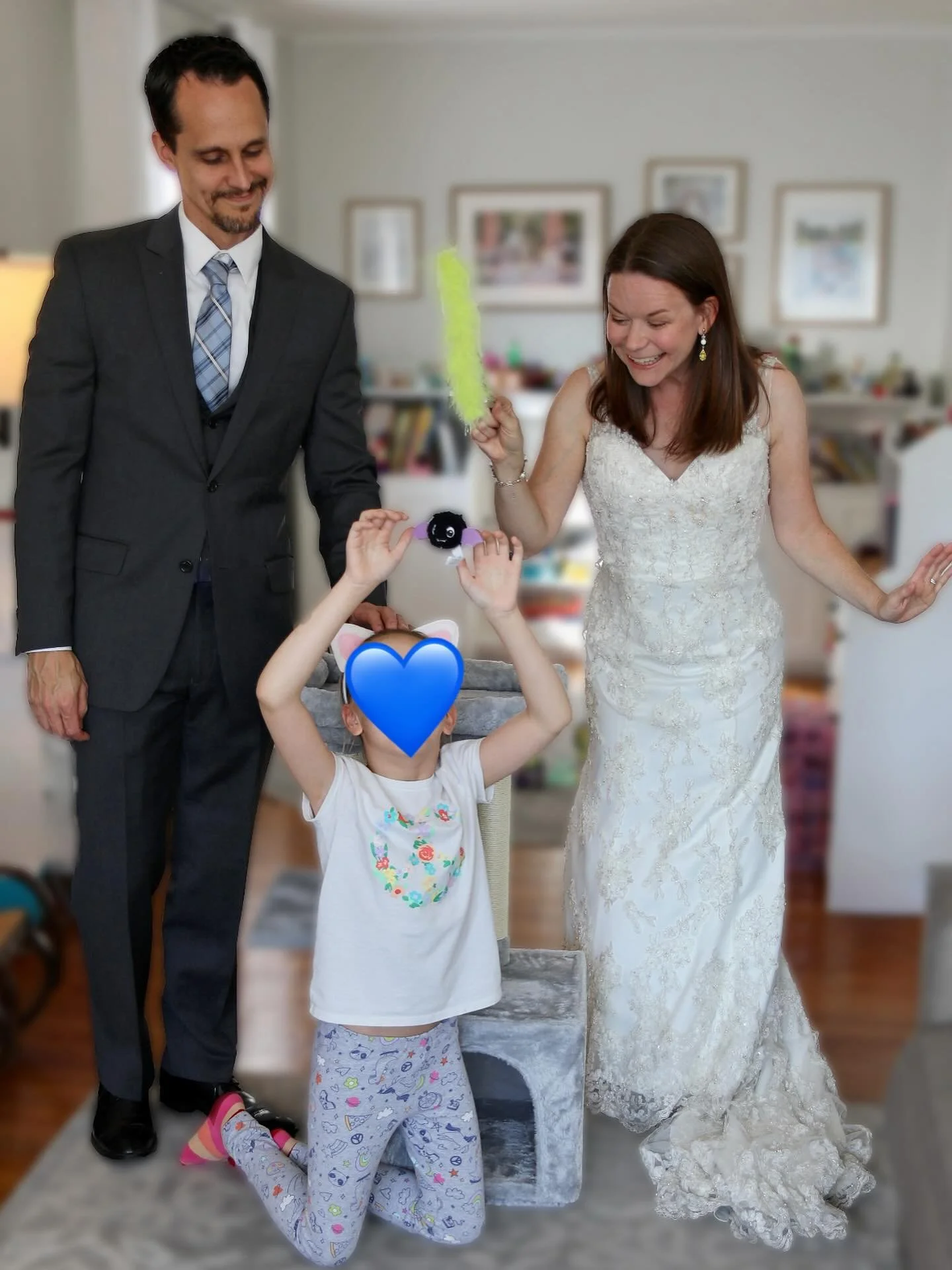 Happy 12 years to us!  Every year we put our wedding clothes back on, try to zip them all the way (never happens), and take a picture representing something in our lives today.

I love that my daughter has joined in on the tradition and gets to share