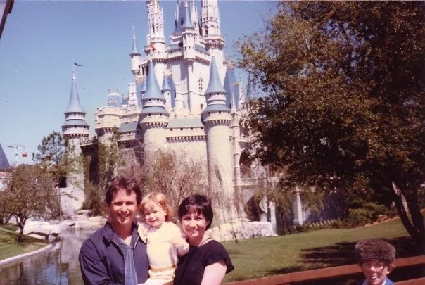 Baby Stephanie at Disney World in front of Cinderella's Castle