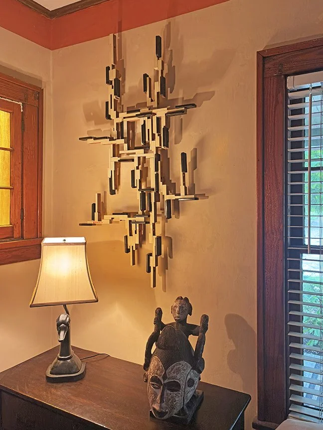 “Silent Symphony”, sculpture, 88 reclaimed piano keys (ivory and wood), 50” x 27” x 4”. 