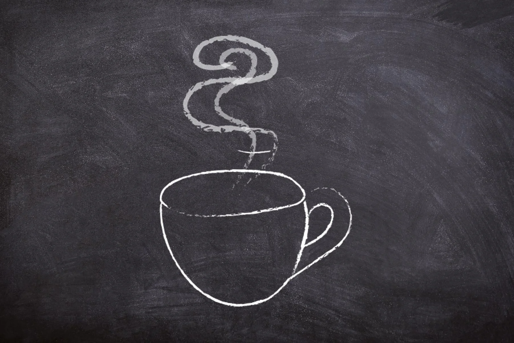 Chalk drawing of a steaming cup on a blackboard background.