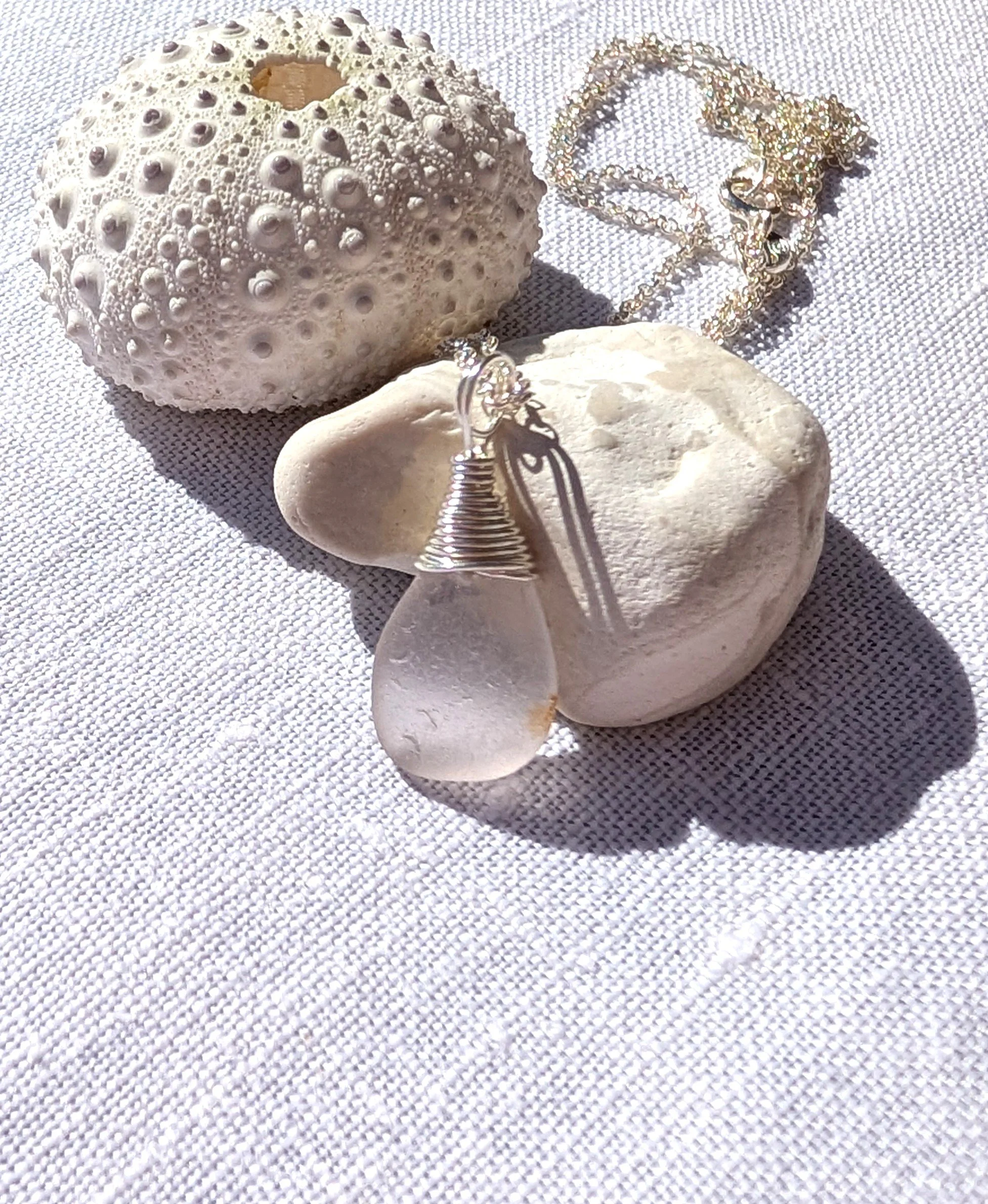 White-with-pink-hue-sea-glass-silver-wire-top-necklace (6).jpg
