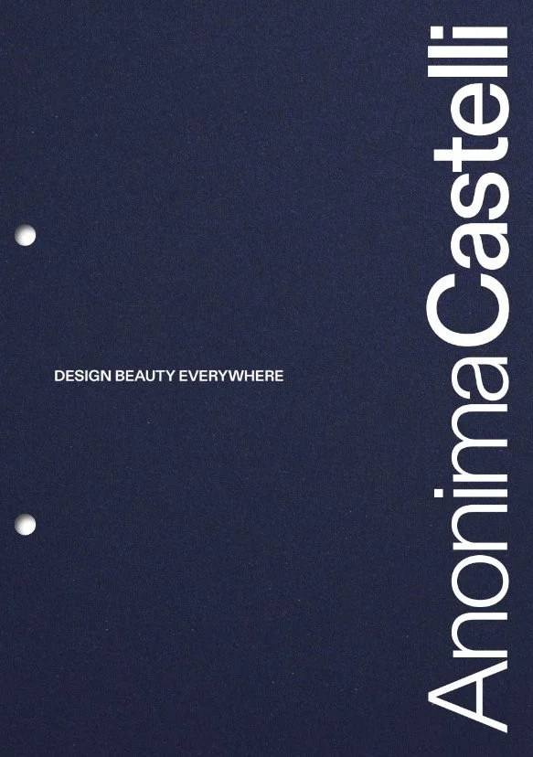 A dark blue notebook cover with the text 'Aromina Coastlii' vertically along the right edge and 'DESIGN BEAUTY EVERYWHERE' in small white font in the middle.