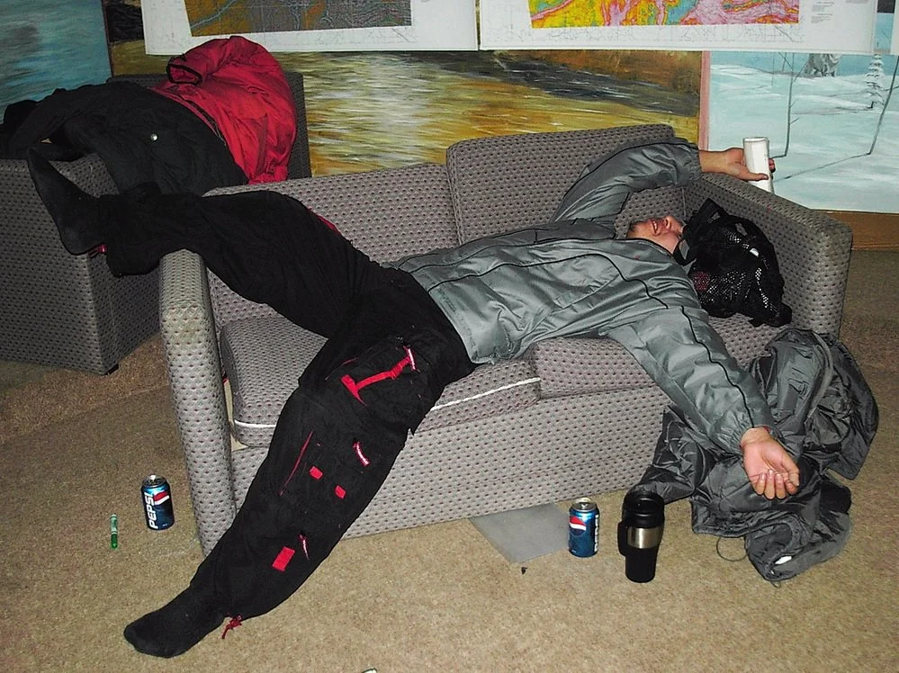 A man at at meeting lying on a couch using non-verbal clues that we did not connect with the audience.