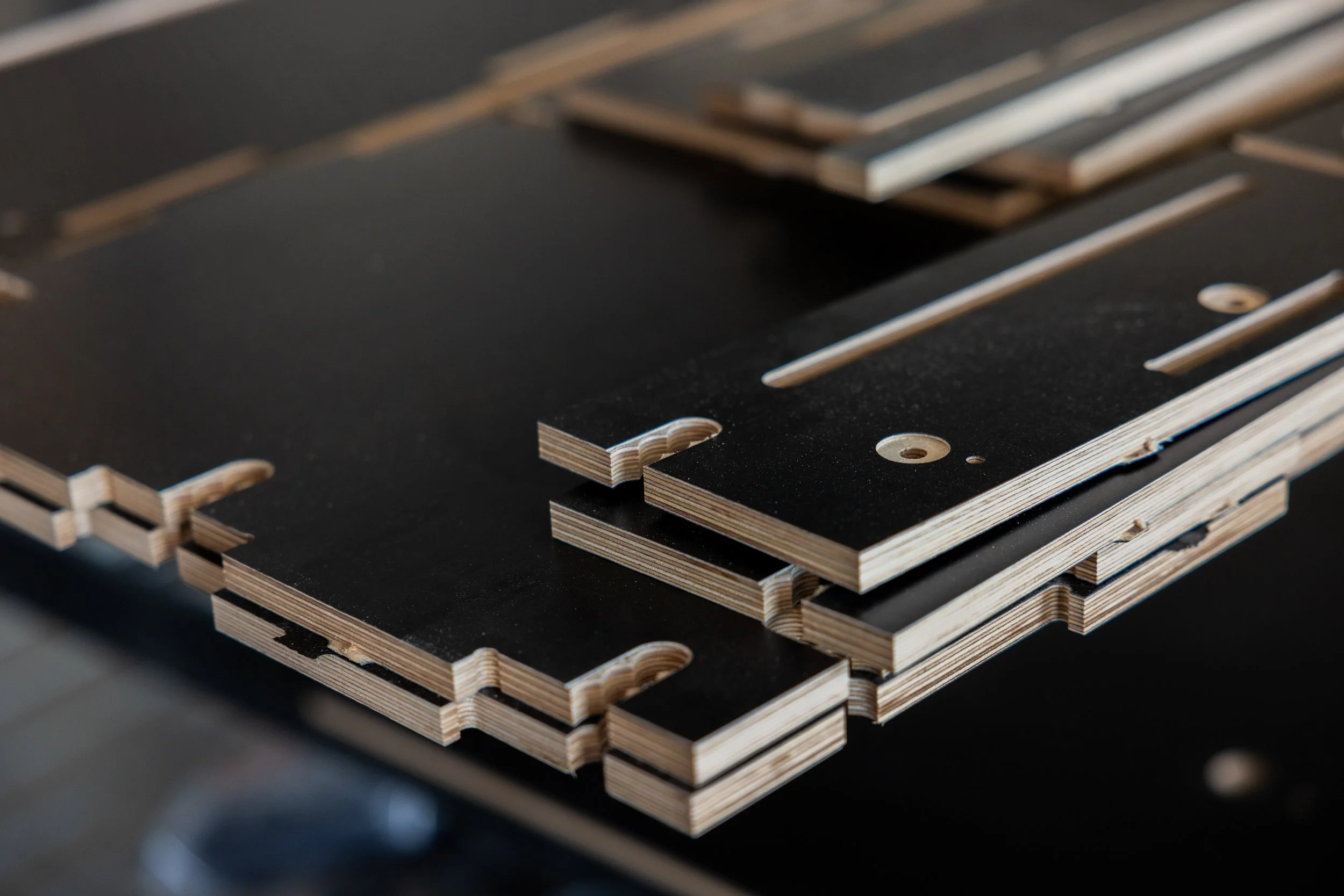 Stacked VICE Outfitters module pieces with some cutouts and fasteners.