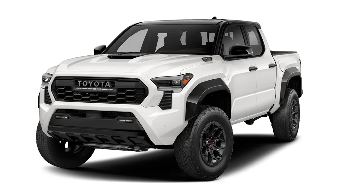 A white Toyota pickup truck with black accents and rugged tires, isolated on a white background.