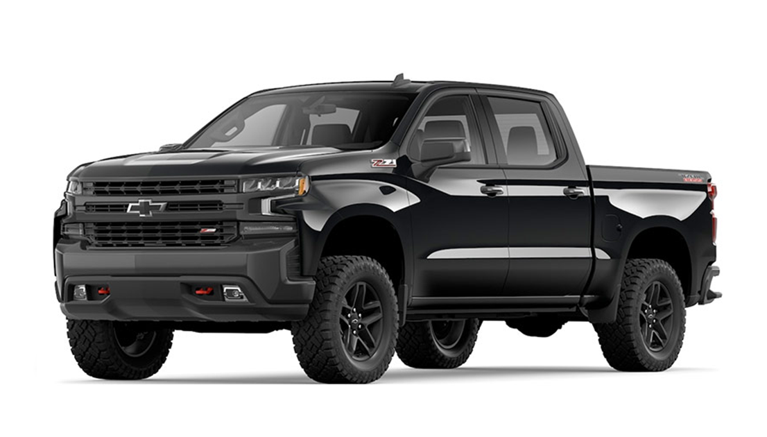 Black Chevrolet Silverado pickup truck with off-road tires and Chevrolet logo on front grille