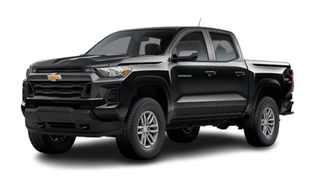 Black Chevrolet Silverado pickup truck isolated on black background.