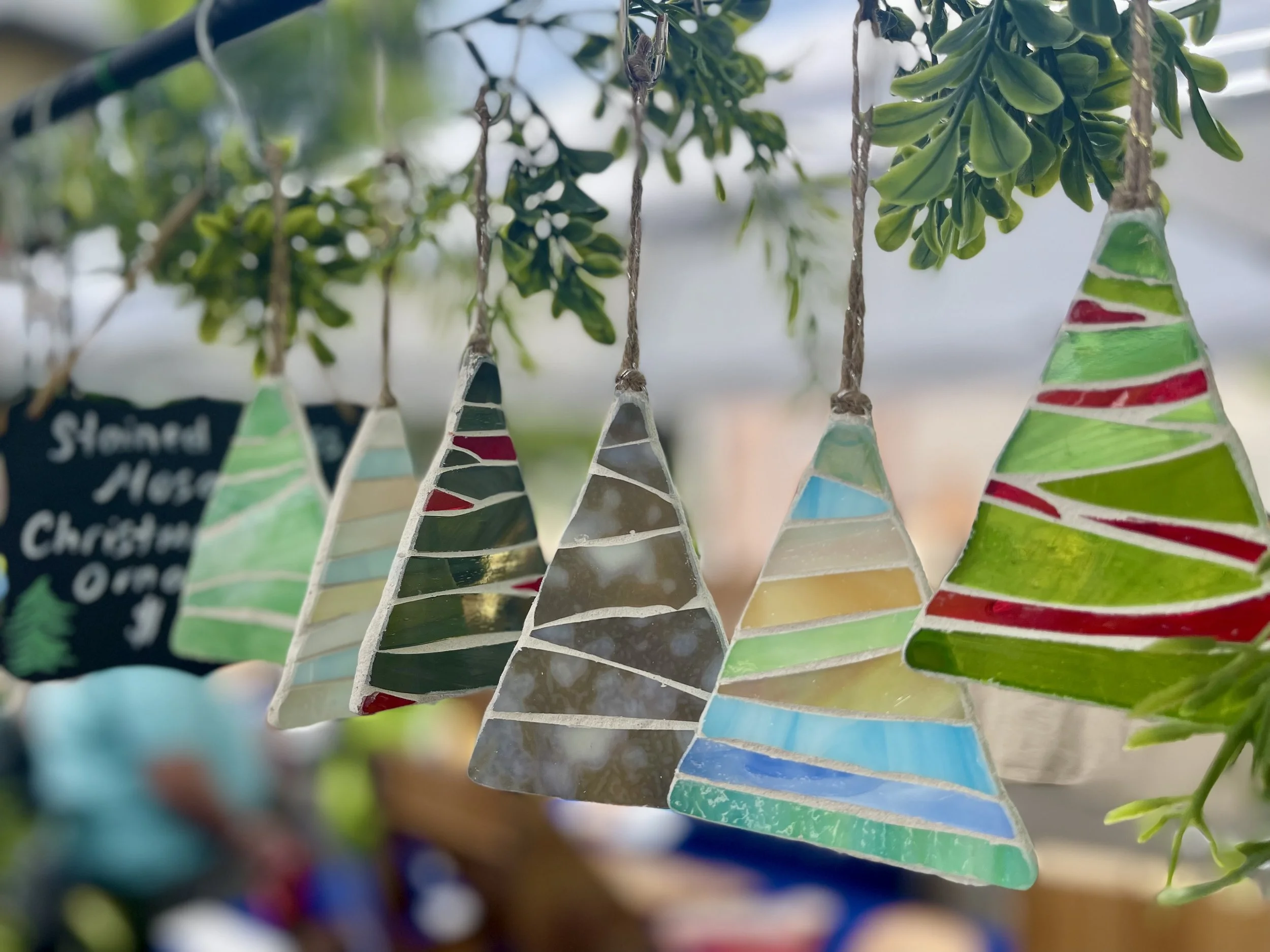 Colorful stained glass Christmas tree ornaments.