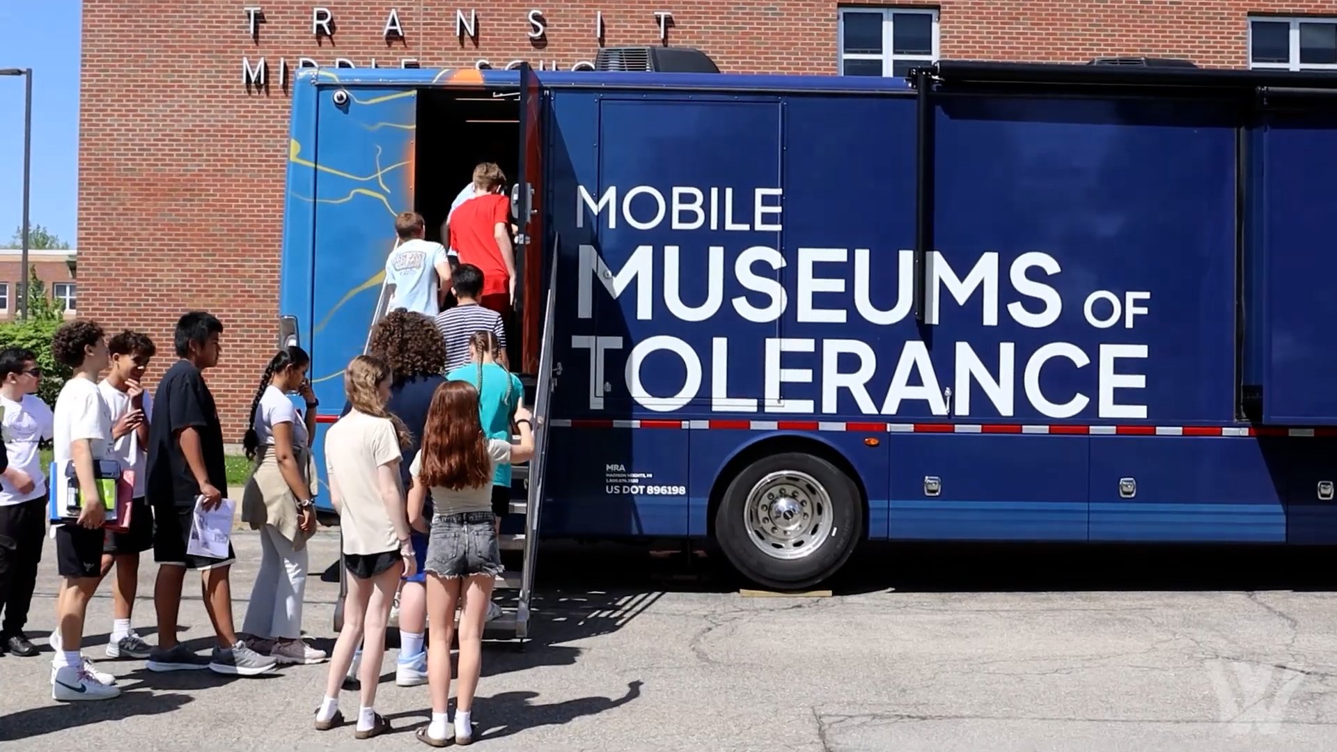 MMOT Kids going on Bus.jpg