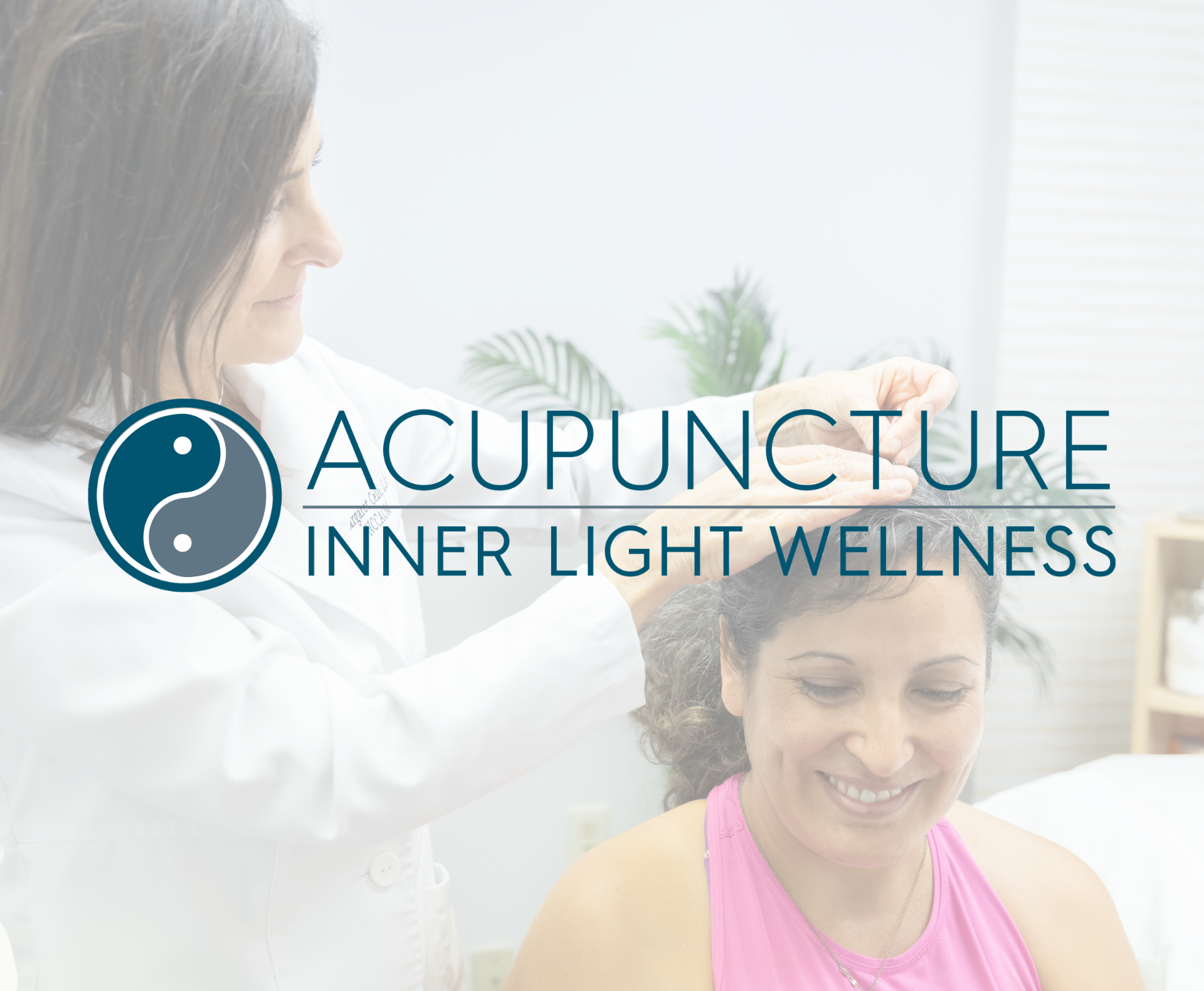 A woman receiving acupuncture treatment on her head from a practitioner in a clinical setting.