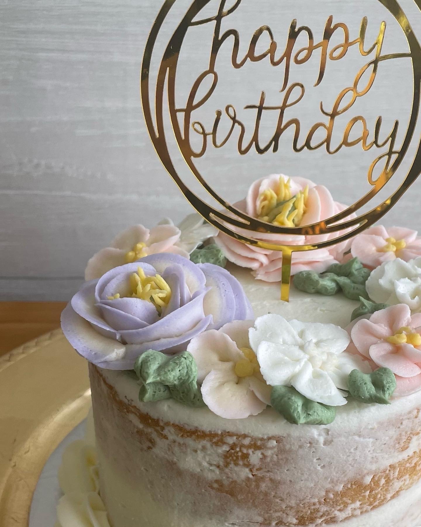 Naked cake with Buttercream florals.jpeg