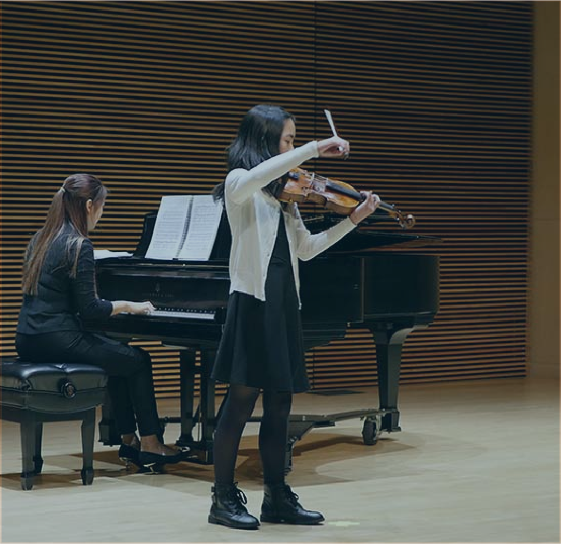 Student of Elizabeth MacCorquodale playing violin for the spring recital