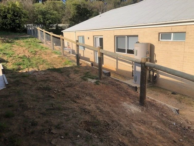 Cypress posts and chicken wire fence.jpg