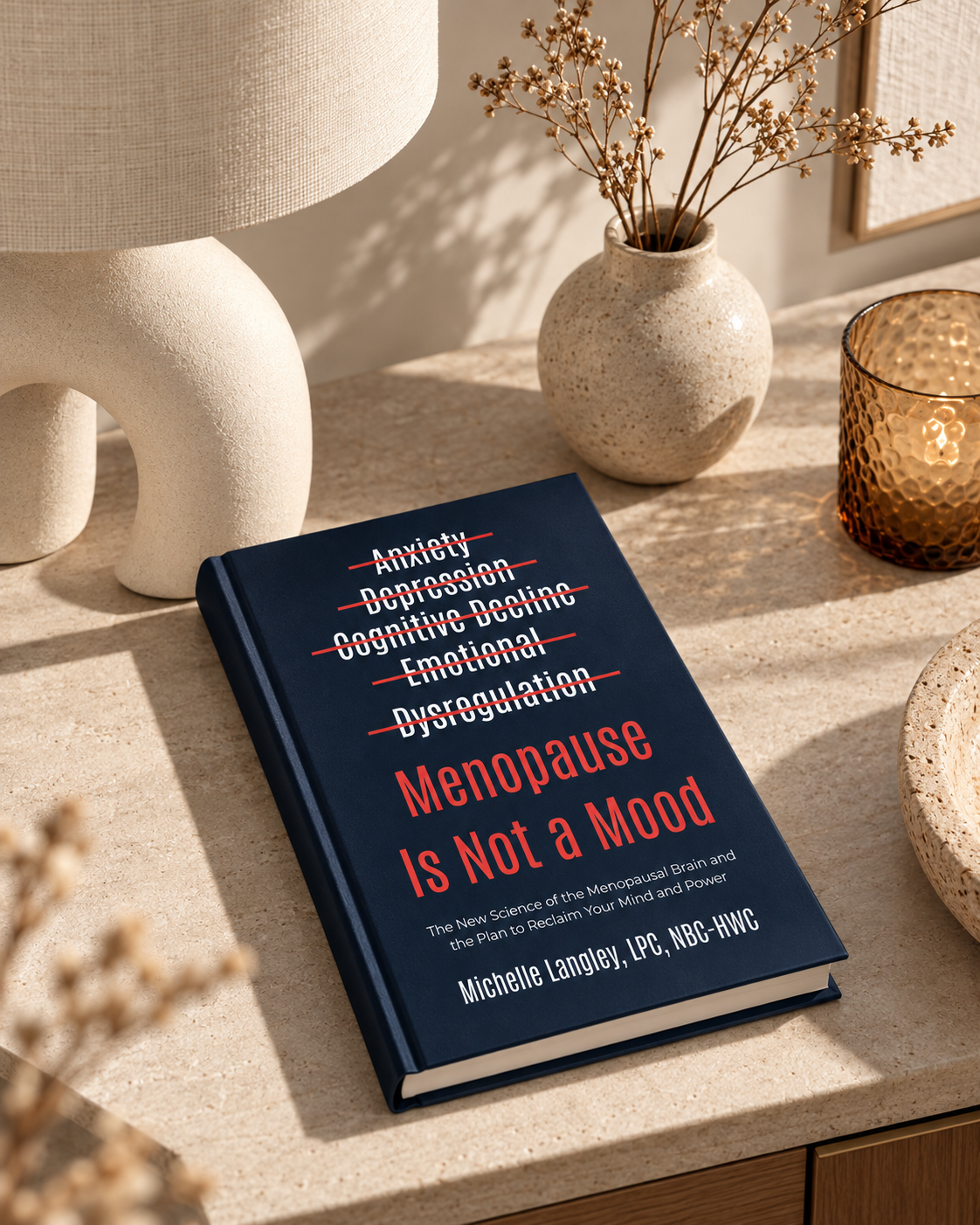 Menopause is not a mood book sitting on console with lamp
