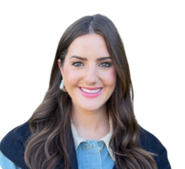 A woman with long dark hair, smiling, wearing a blue top and earrings, against a white background.