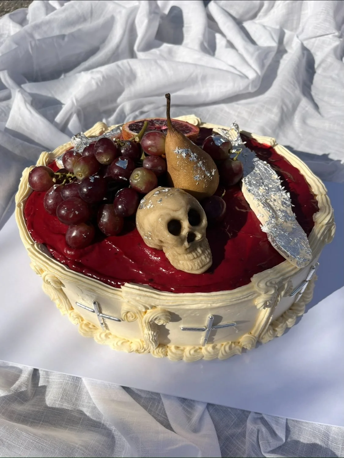 A Vanitas cake for a vampire ball! 

&ldquo;Vanitas is a Latin term for an artistic genre of 17th-century still-life painting that symbolizes the transience of life, the futility of earthly pleasure, and the certainty of death.&rdquo;

Chocolate sour