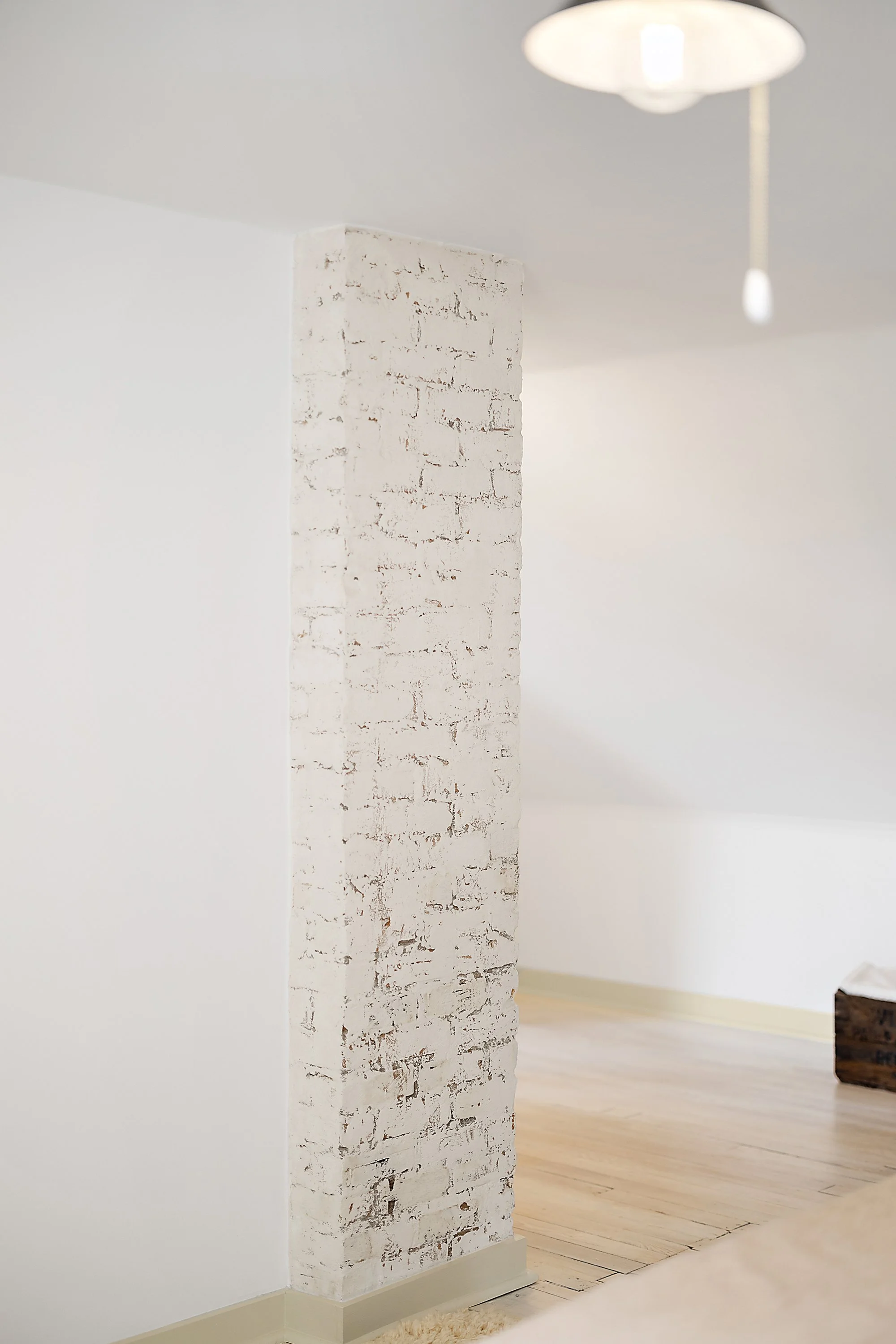 White walls and a chimney. 