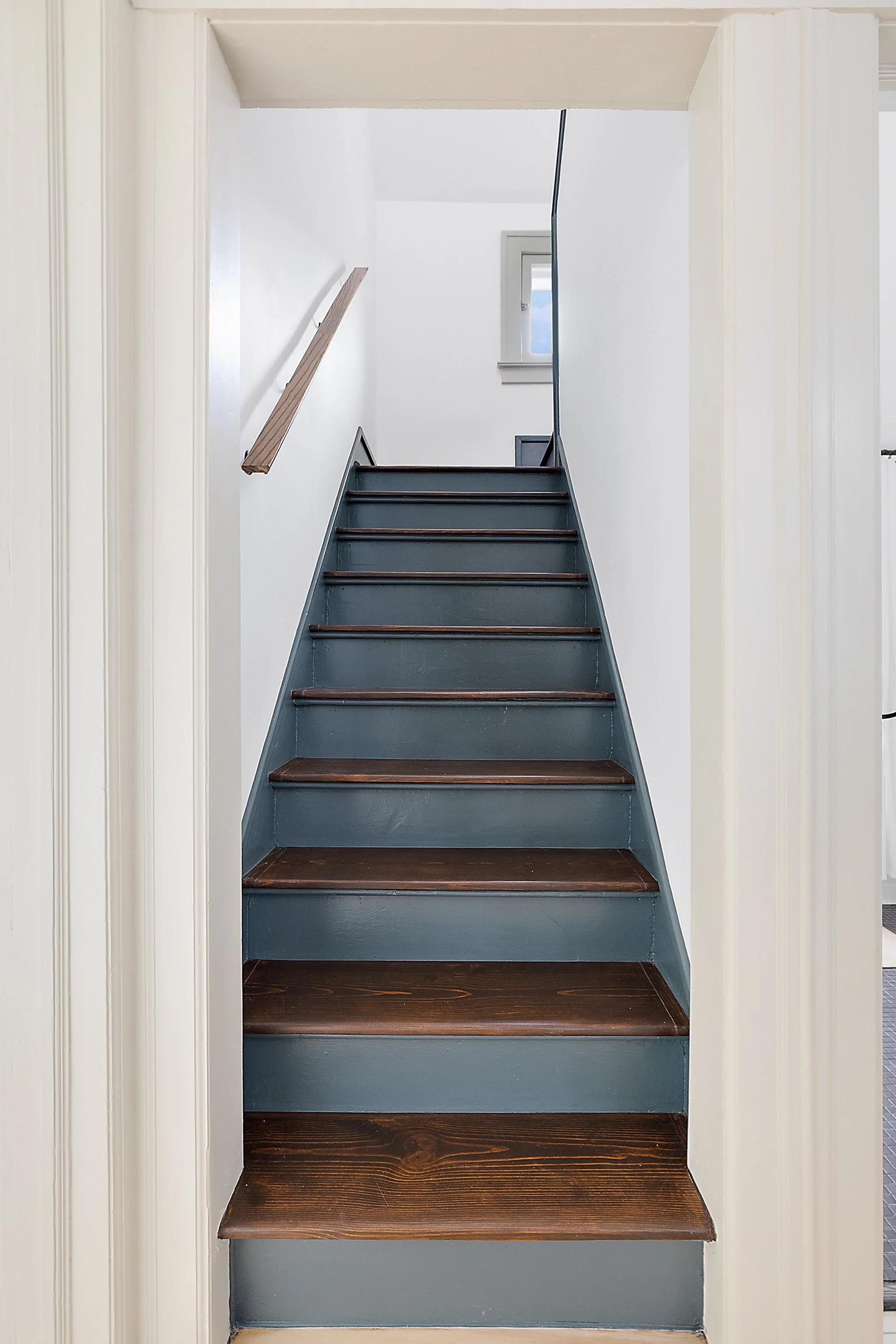 Restores stairwell with wood treads and green kick plates. 
