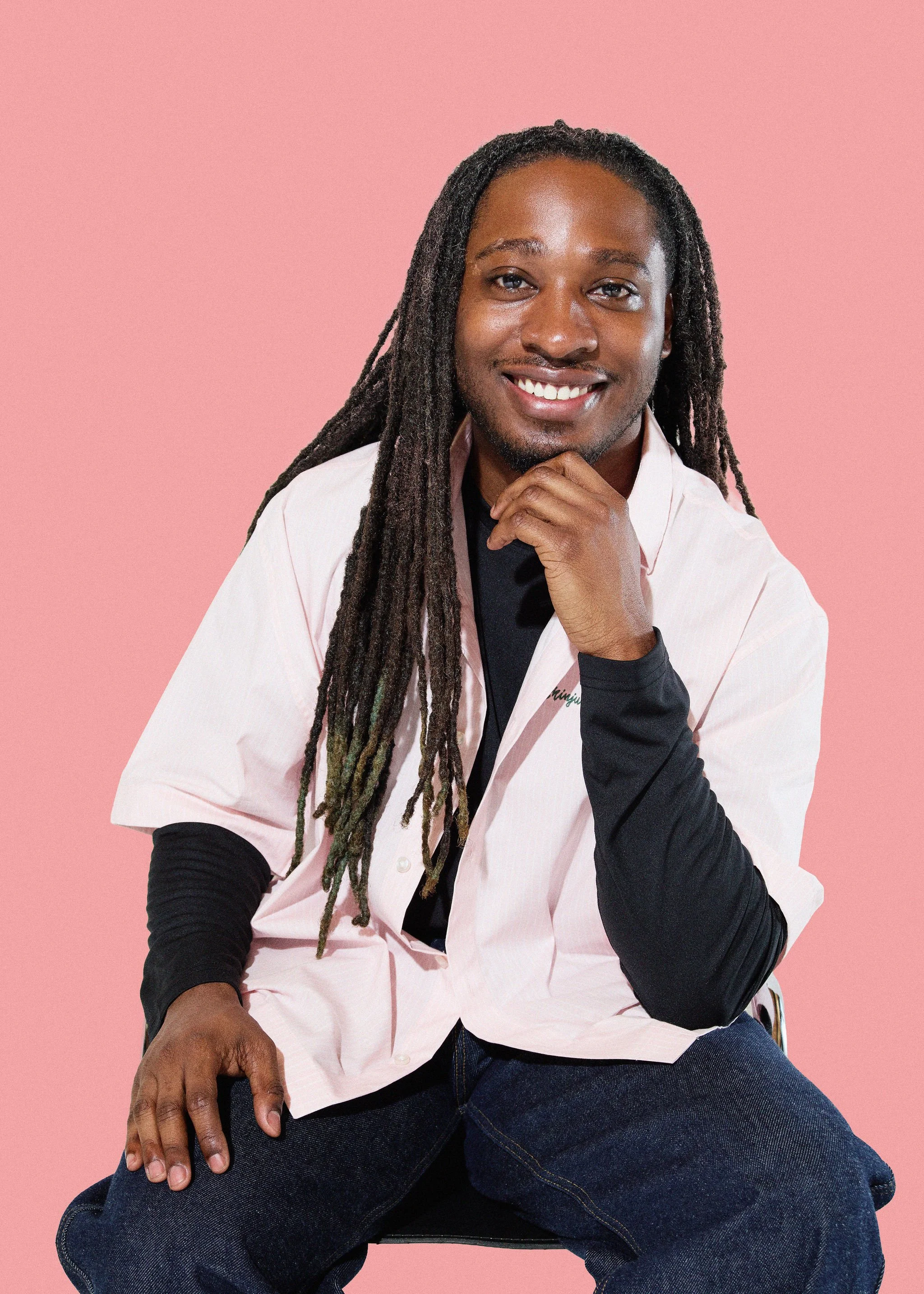 Smiling headshot of Emir Bailey, Therapist at For Real Therapy in Chicago