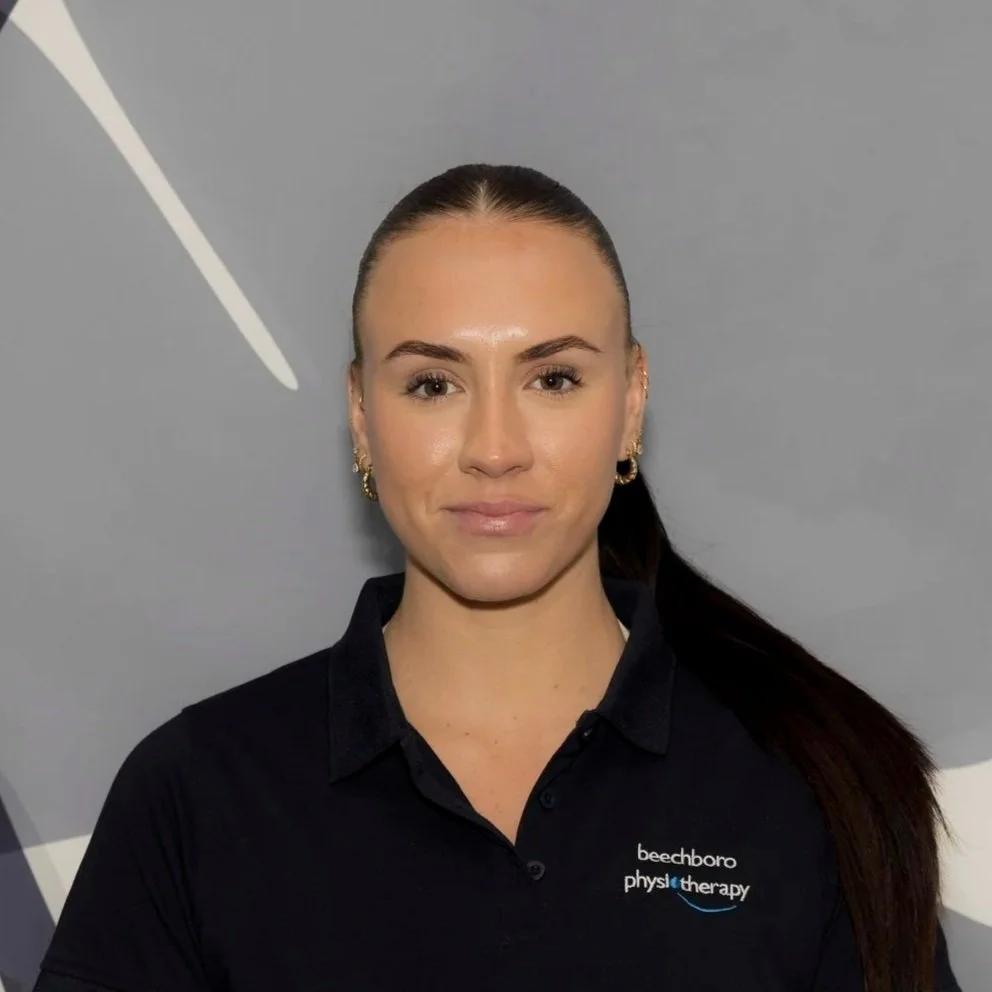 Kelsey Curtin wearing a black polo shirt with a logo that reads 'beechboro physiotherapy'.