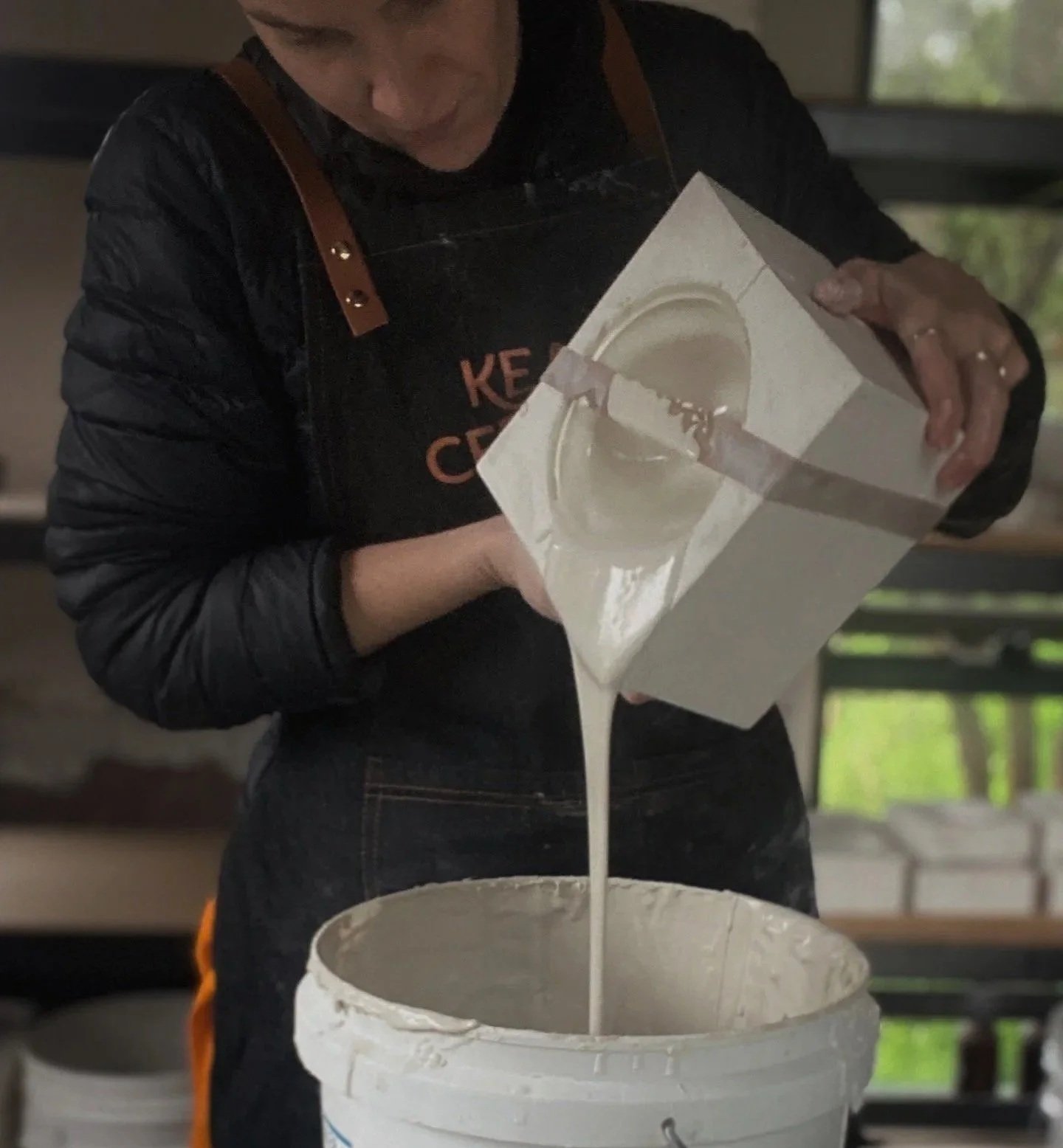 Deanna Pouring porcelain slip out of mould