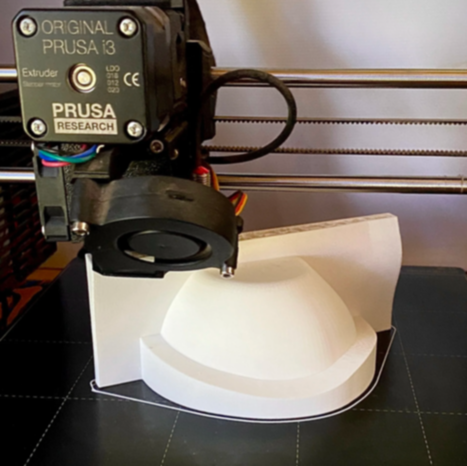 Half of a stacking bowl being 3D printed, the master shape used to make a plaster mould