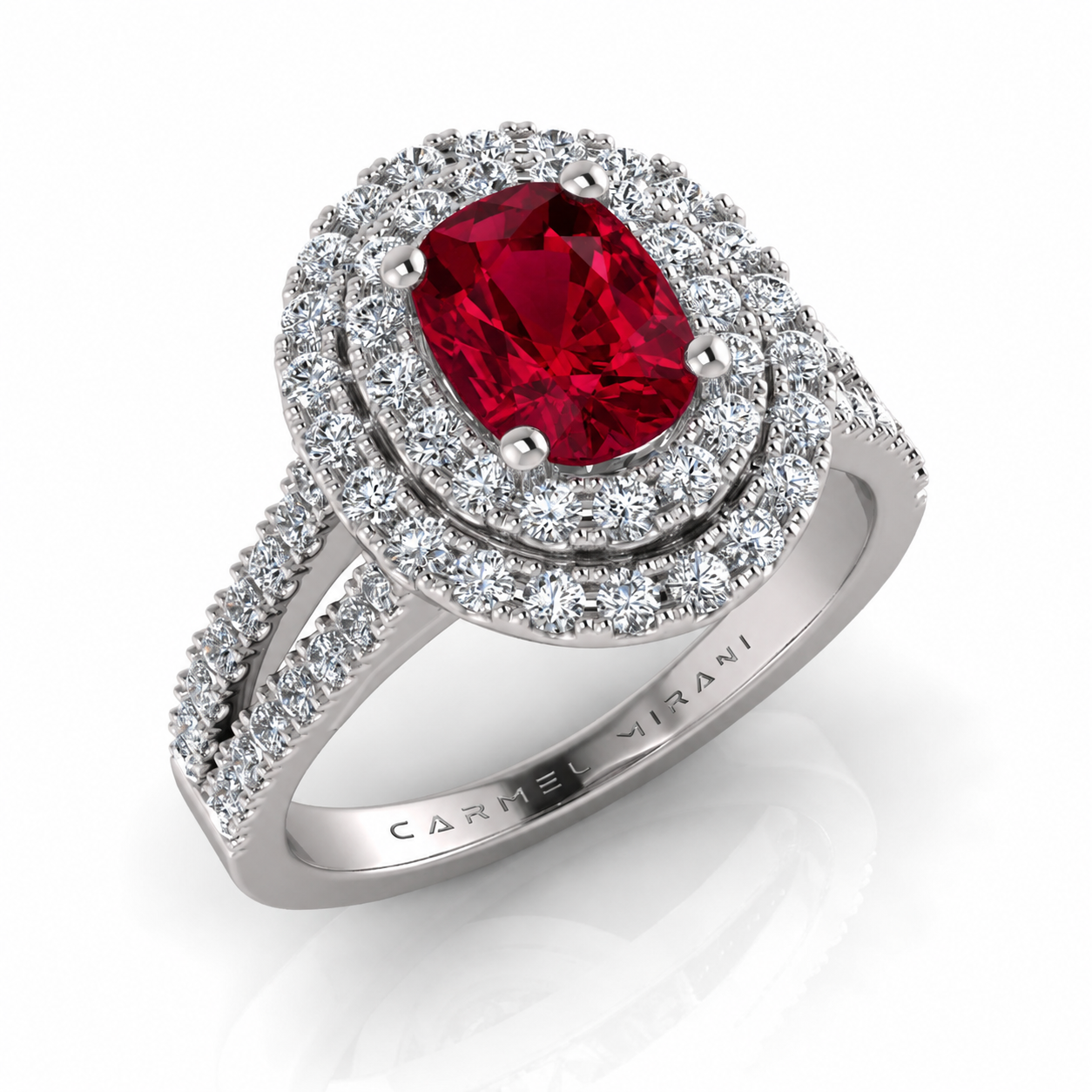 Silver ring with a large red gemstone surrounded by multiple rows of small clear gemstones.
