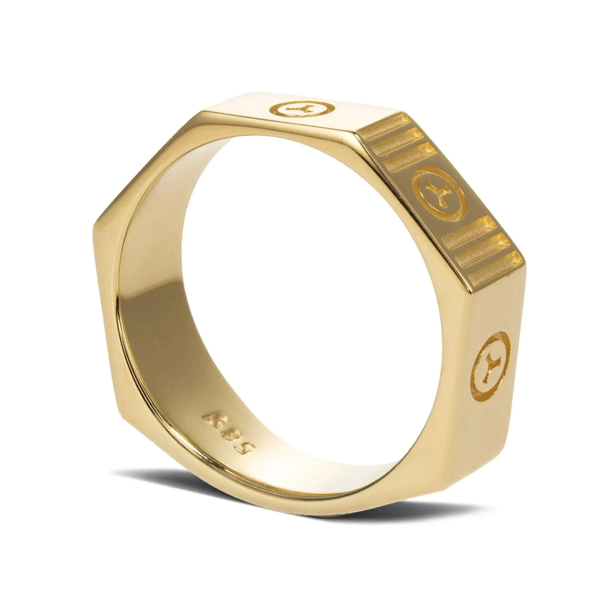 Close-up view of a gold ring with engraved Cartier logo and design.