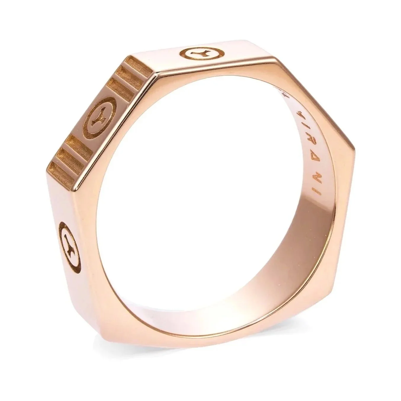 A close-up of a rose gold ring with engraved logo and text inside.