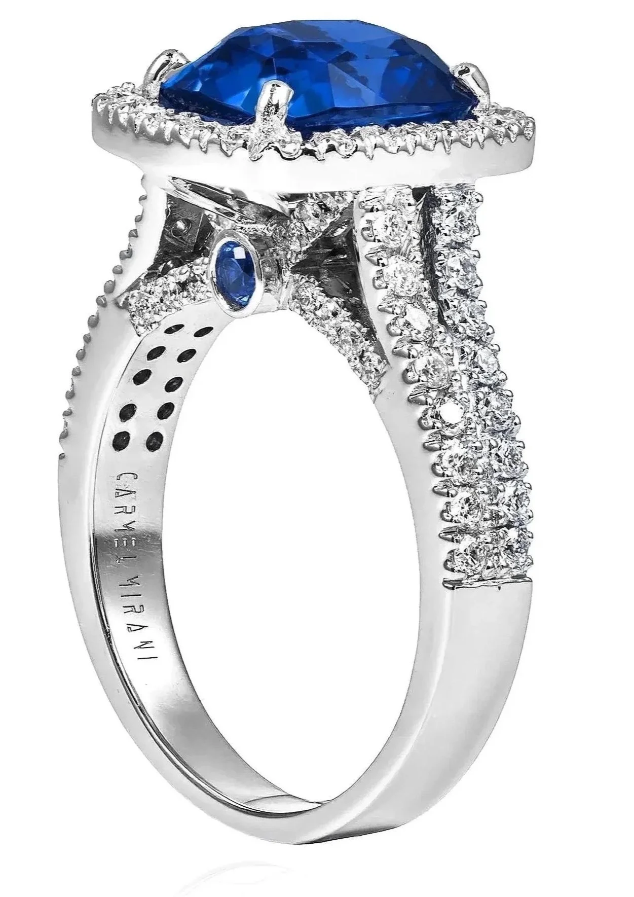 Silver ring encrusted with small diamonds, featuring a large oval blue gemstone at the top and a side profile with additional diamond accents.