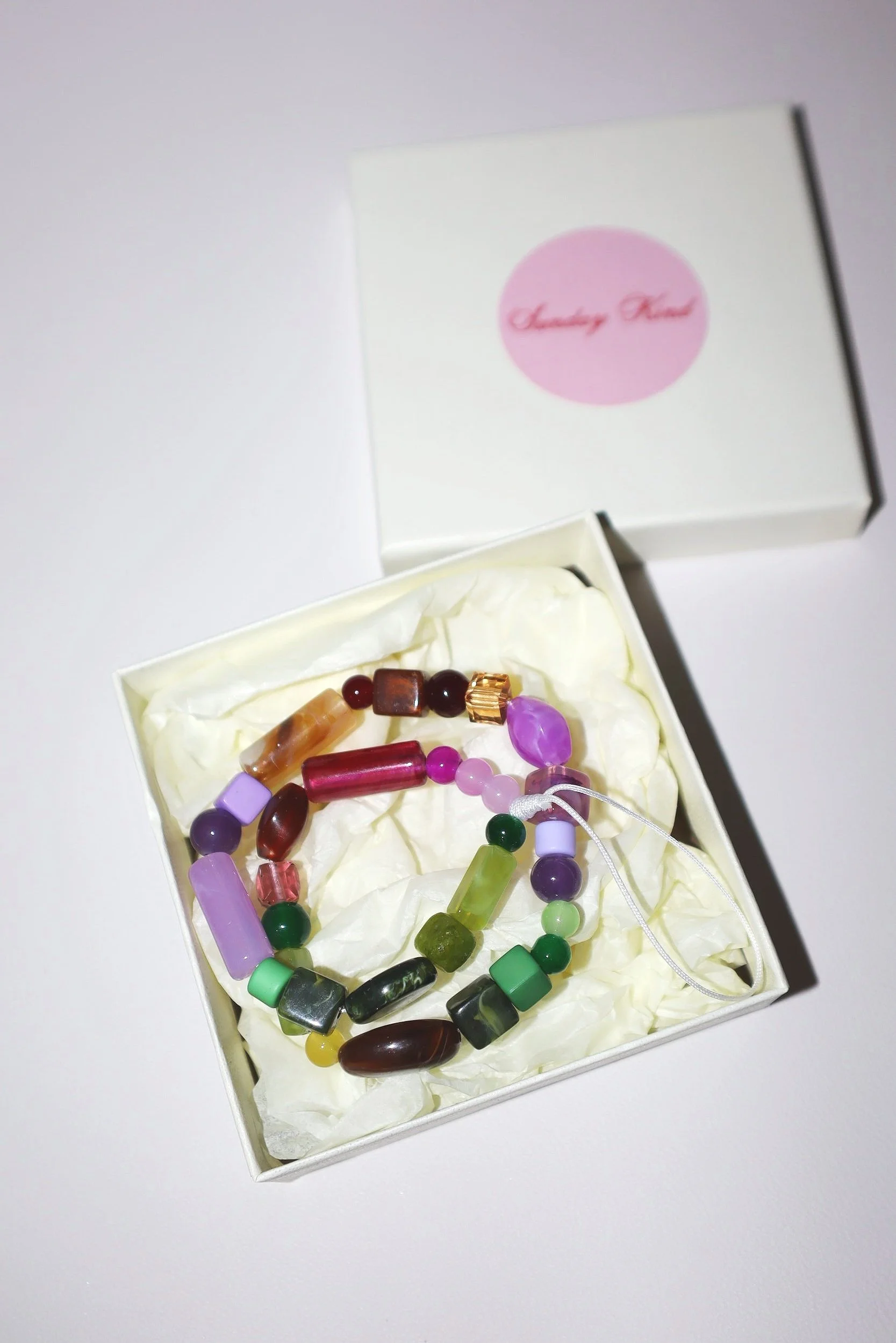 purple green brown phone charm