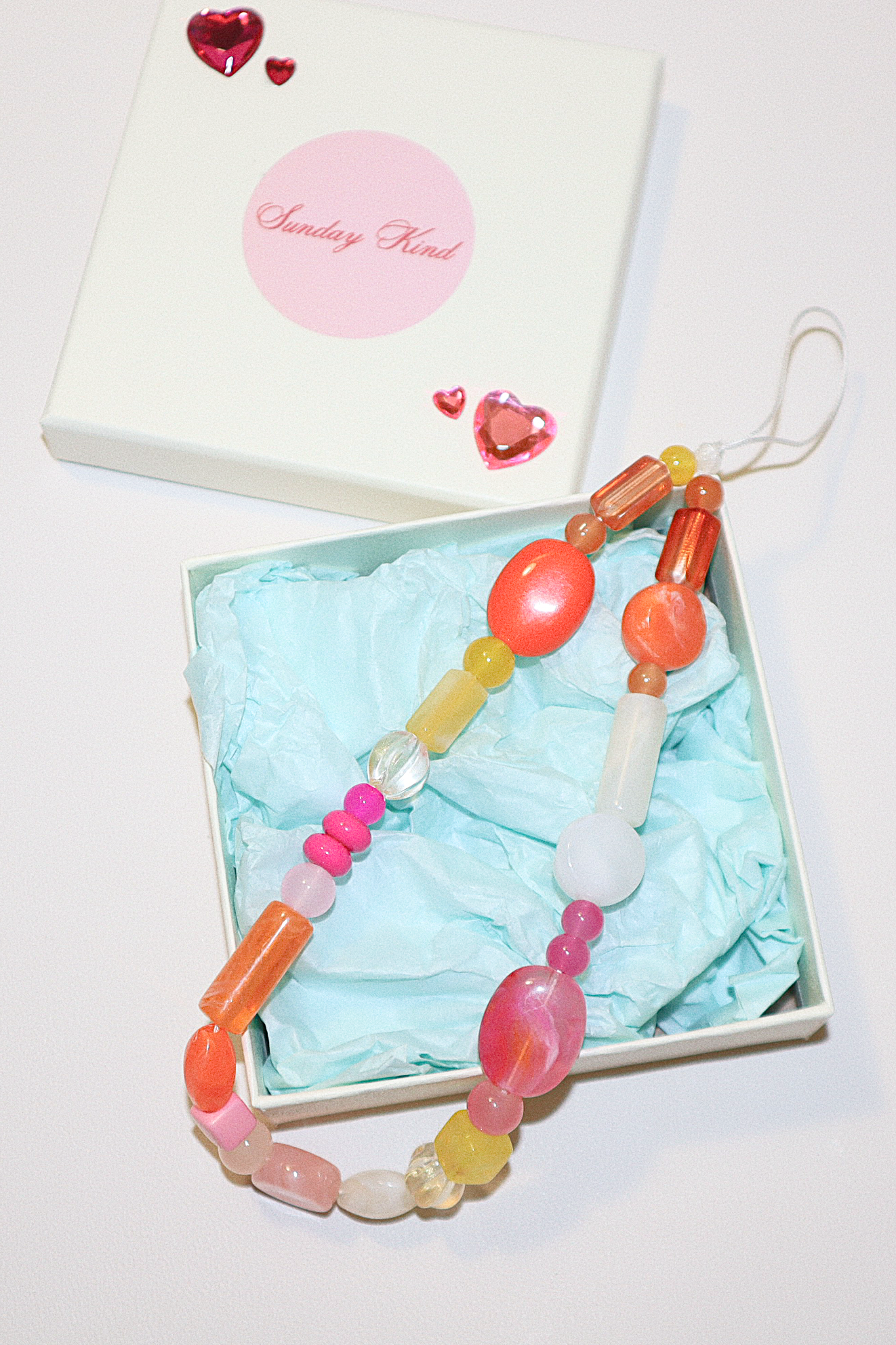 phoebe pink orange phone charm