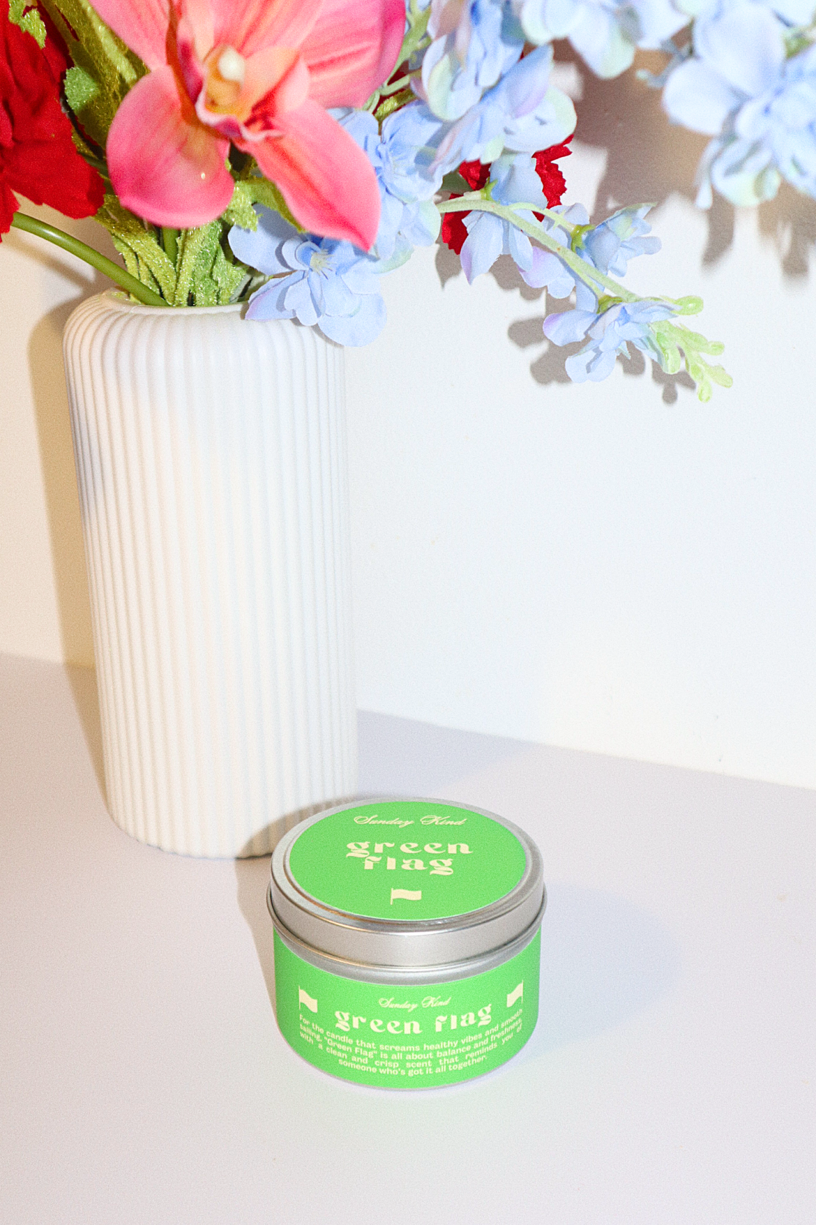 green flag scented tin candle