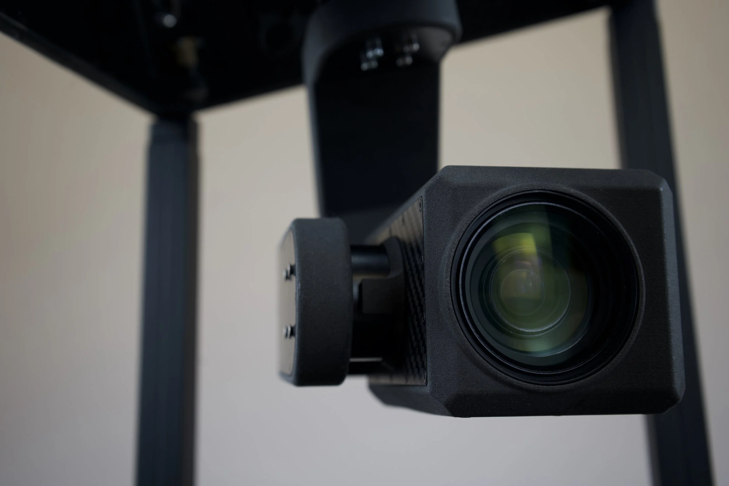 Argus 30 Camera hanging from extension mechanism facing the camera