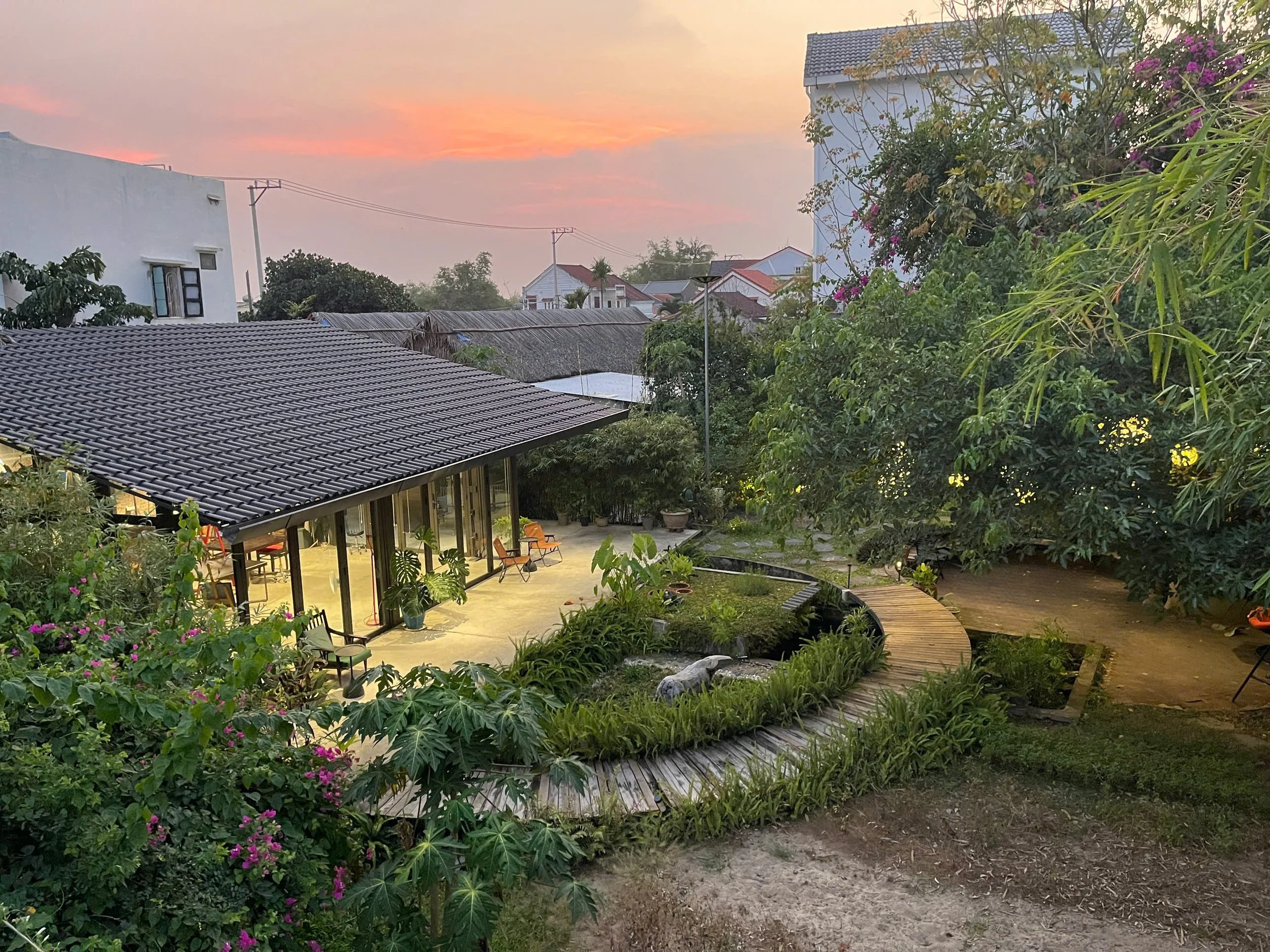 aerial_view_of_art_studio_with_sunset_in_background