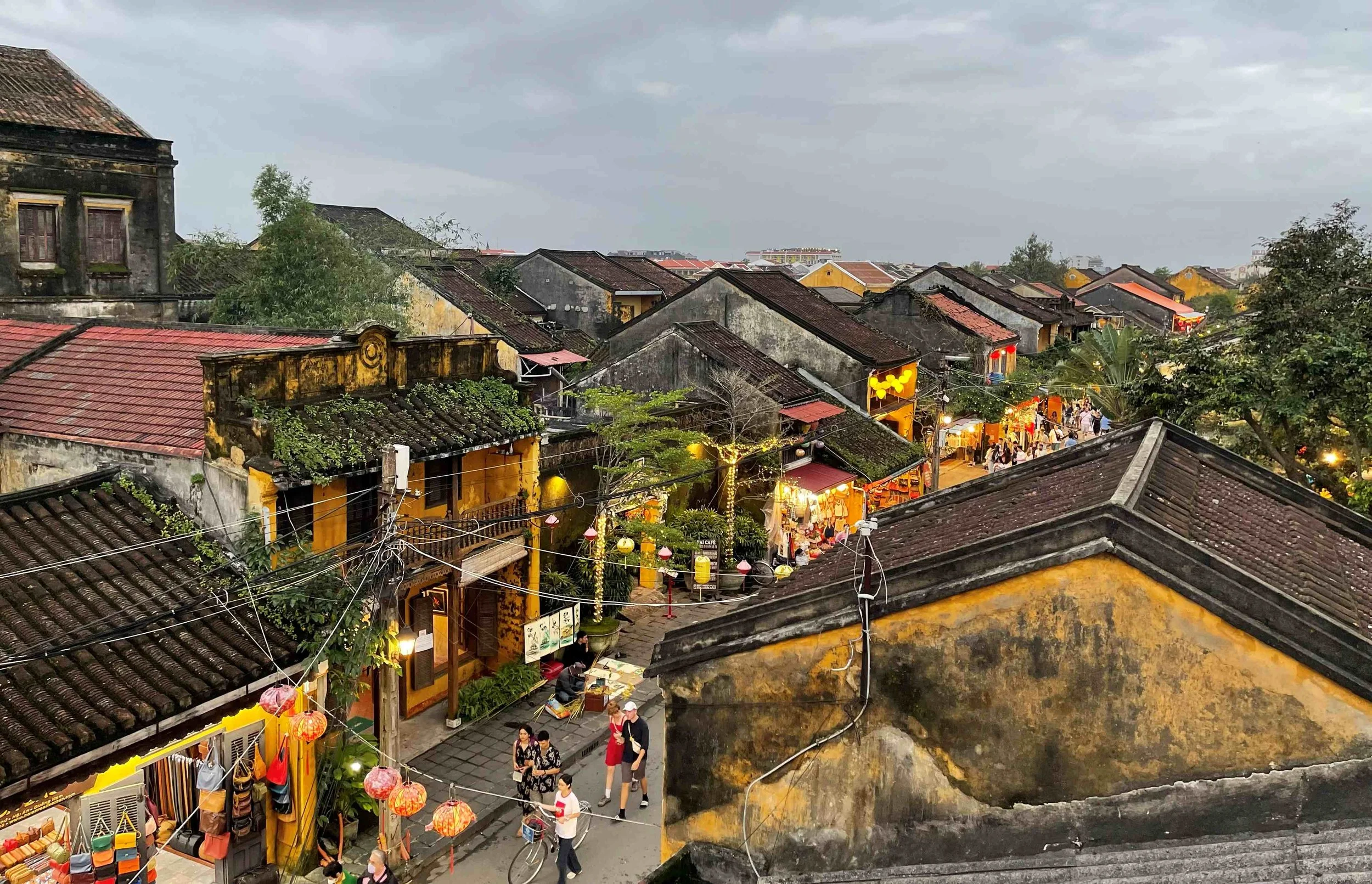 Hoi An Old Town roof top view with cloudy sky traditional houses and lanterns