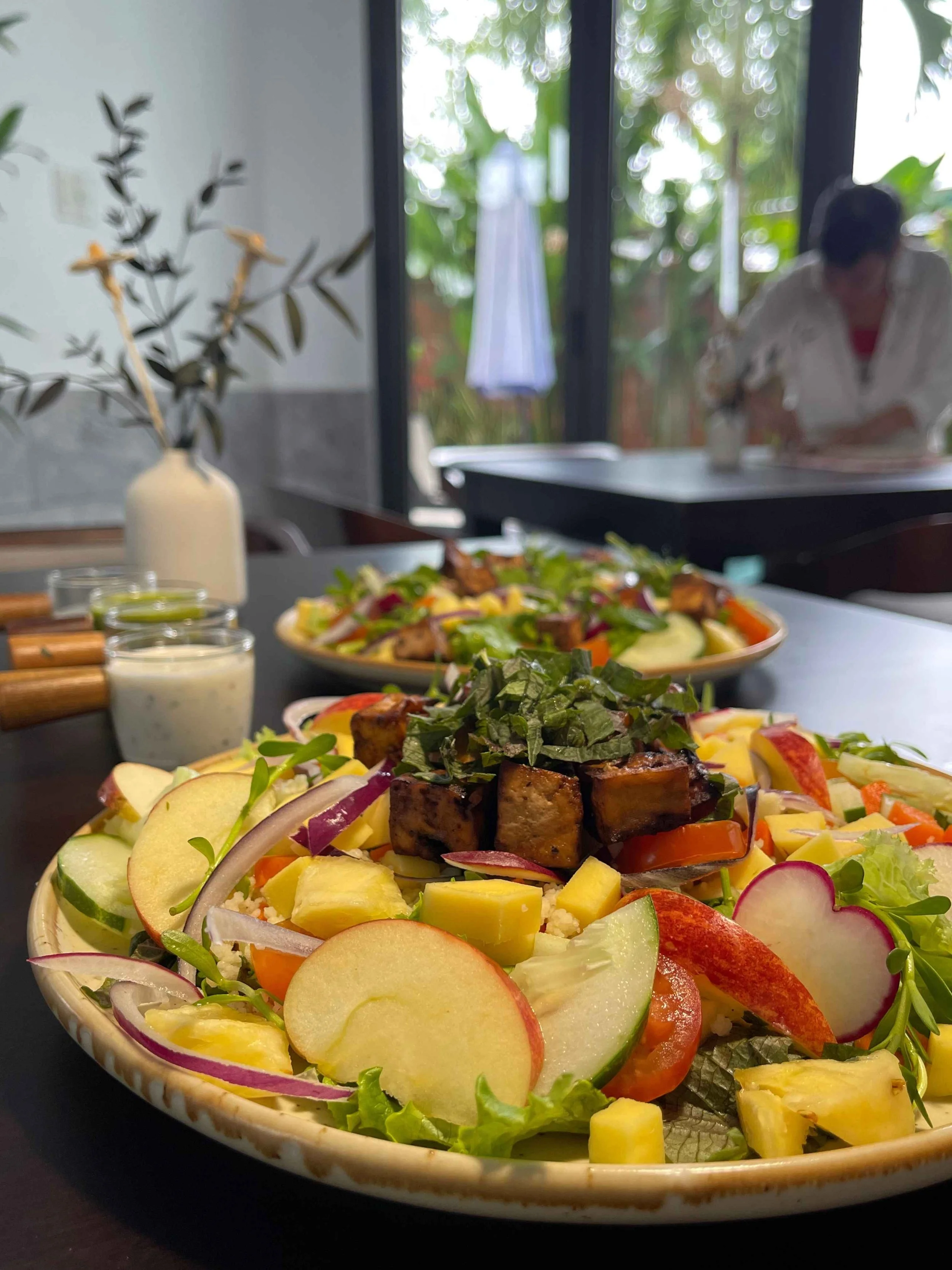 Fresh salad with pan fried tofu and apples