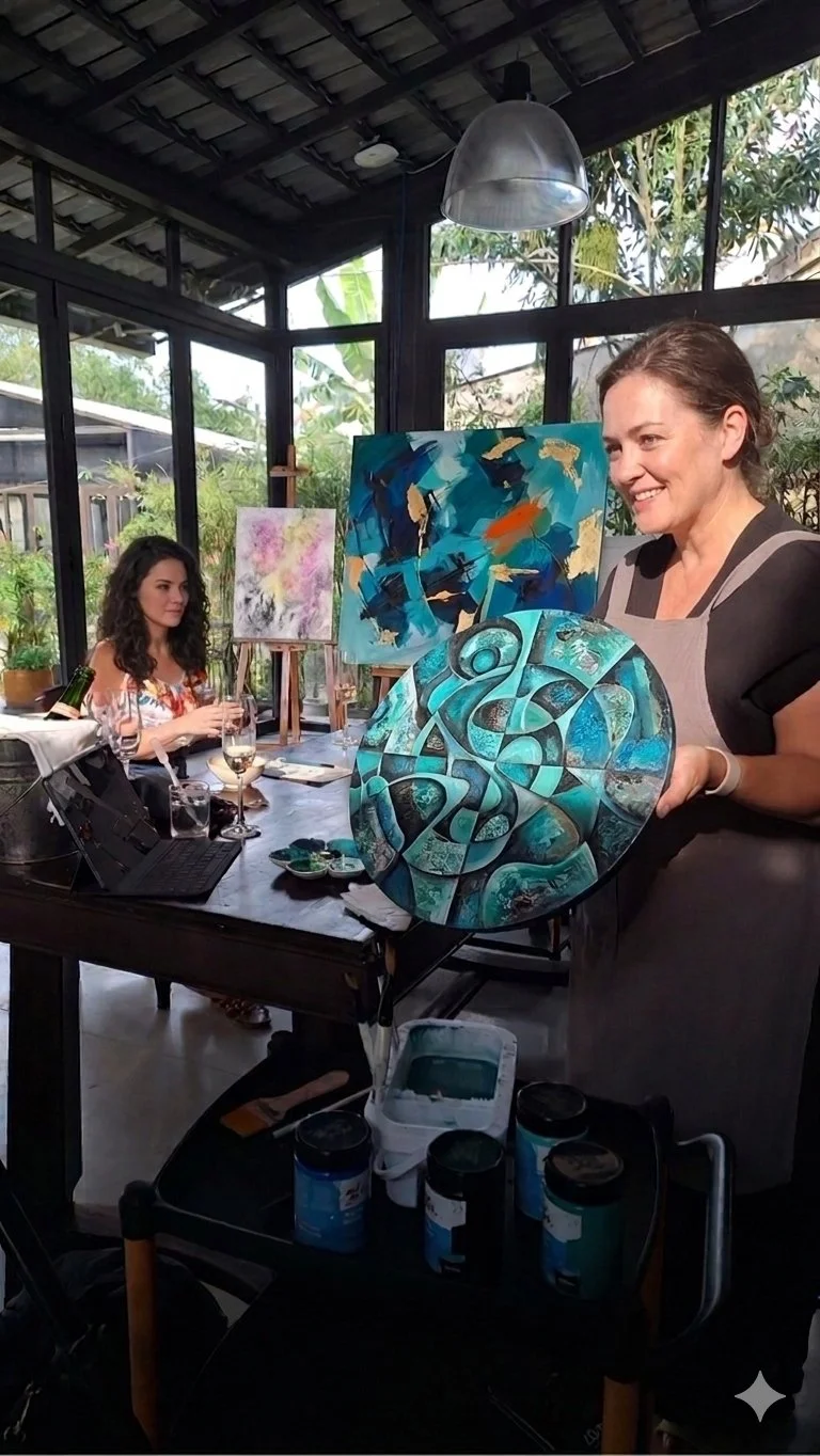 Two guests painting abstract art in an art studio setting with easels in the background