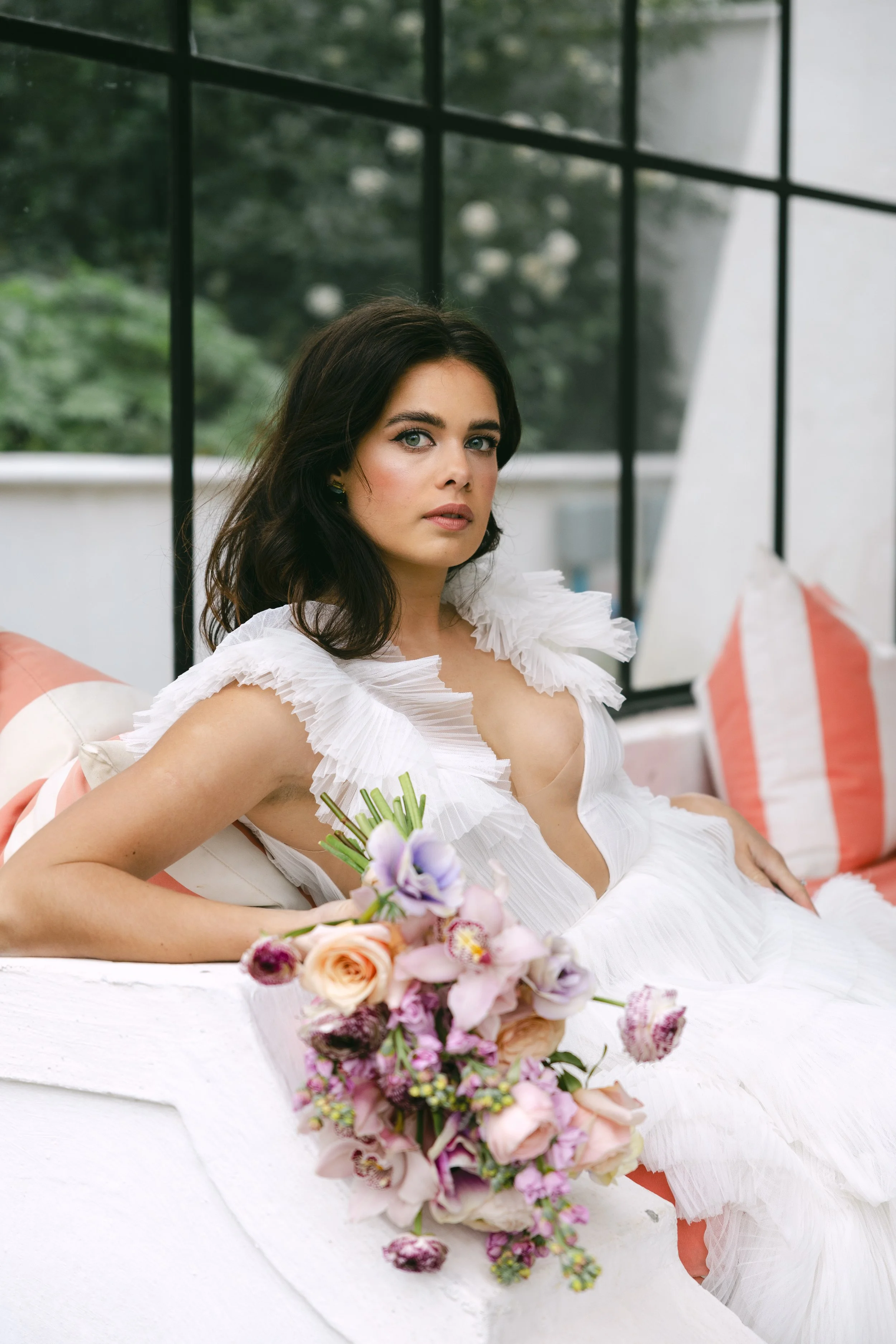 Bride with a fresh, natural bridal makeup look and softly styled hair.