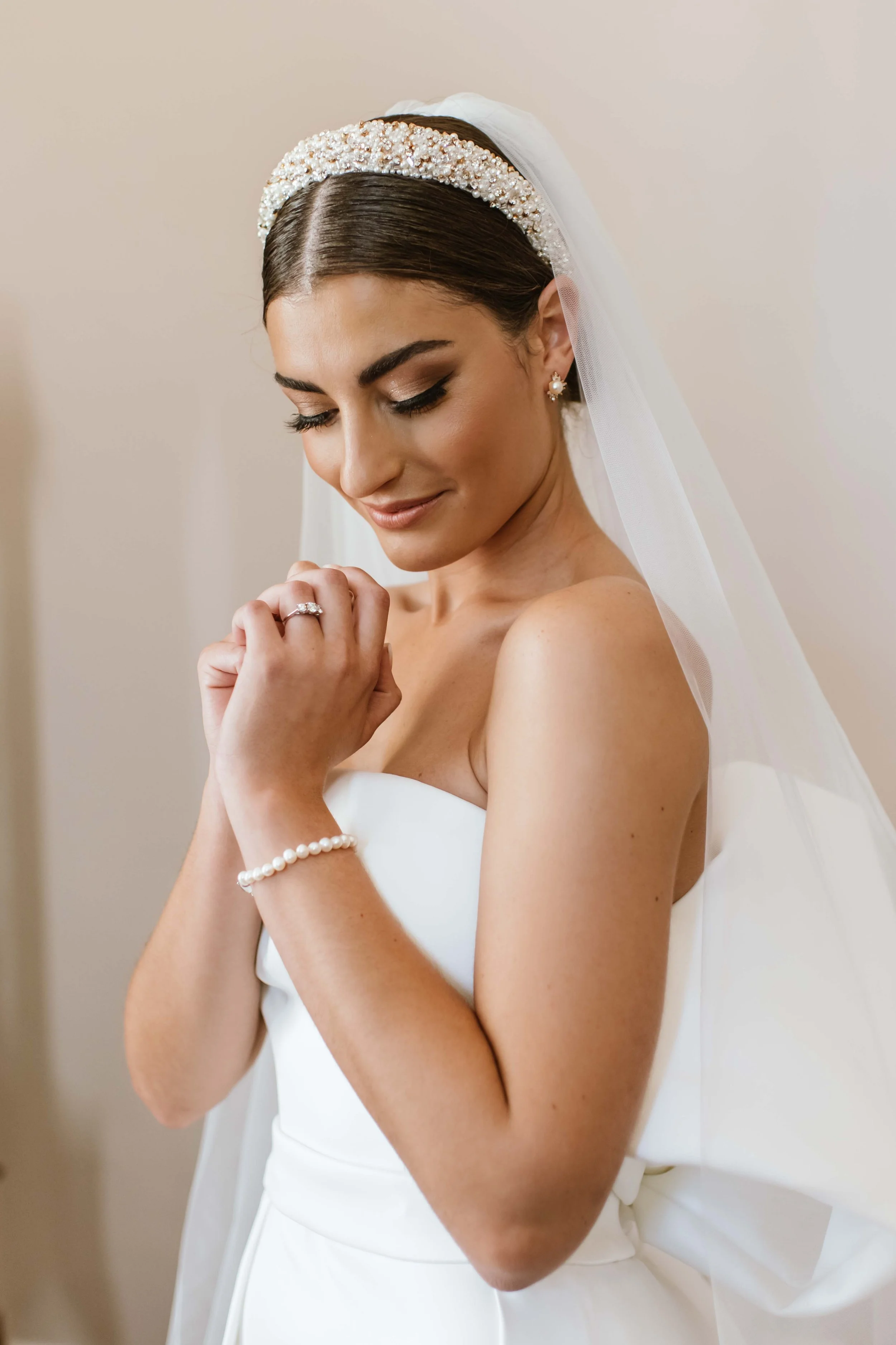 Bride with a fresh, natural bridal makeup look and softly styled hair. 