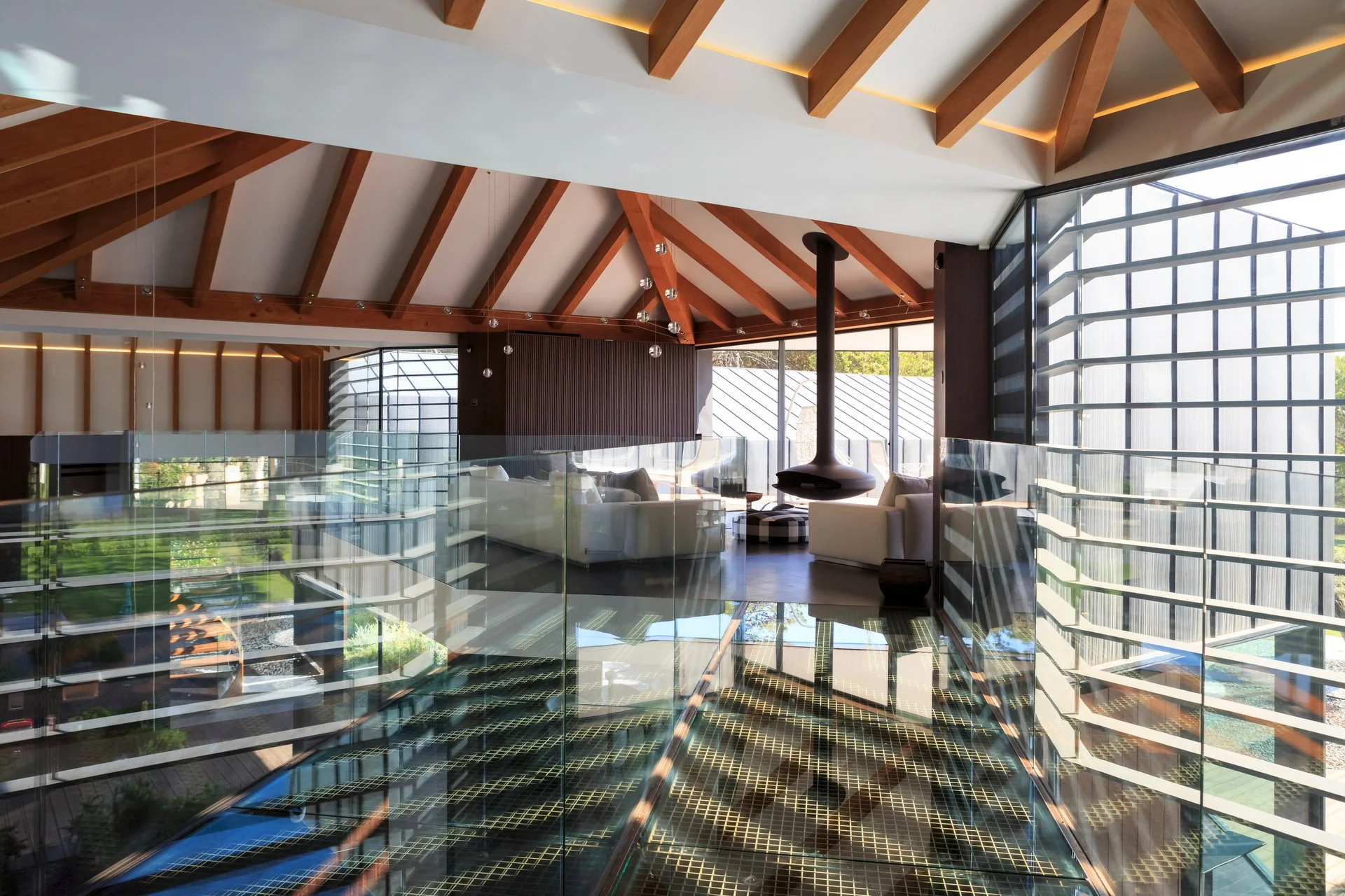 Sun shining through the windows into the living room of one of A+ Interior’s projects