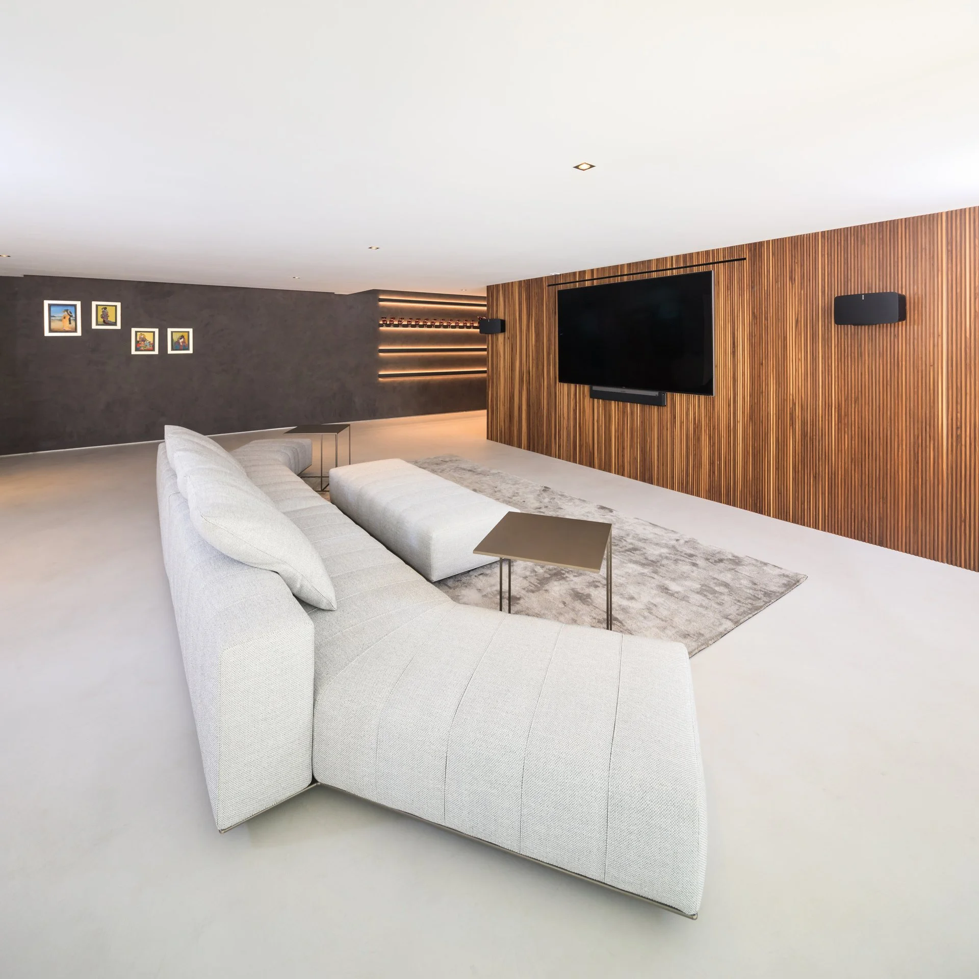 Statement white sofa in a basement project 