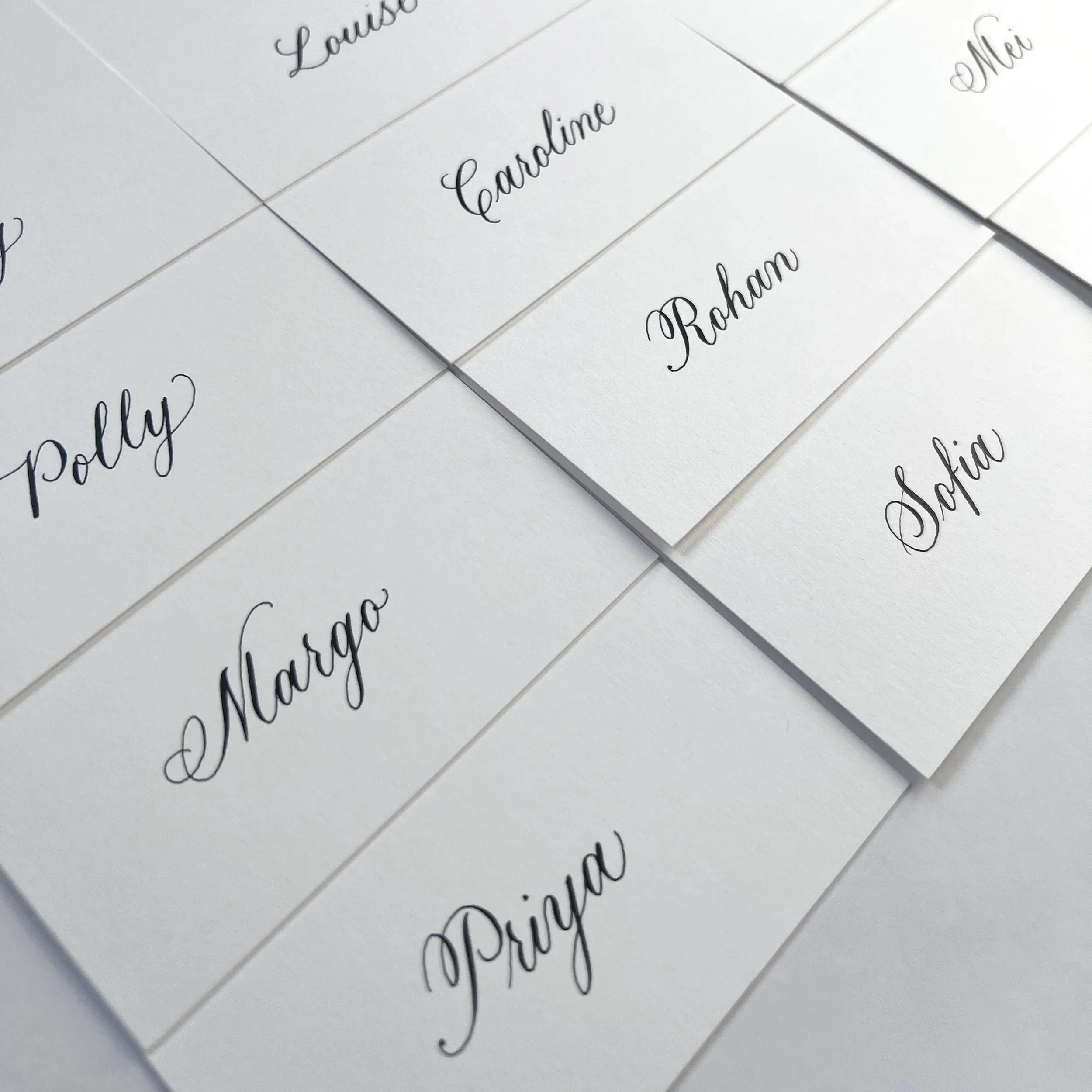 Handwritten copperplate calligraphy place cards on premium card stock