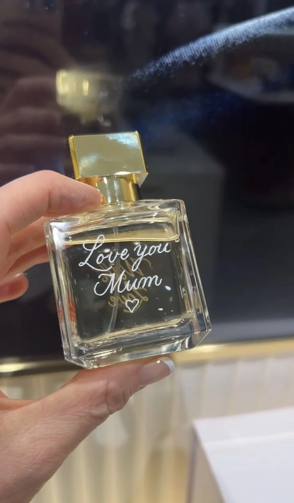 Hand-engraved messages on a Maison Francis Kurkdjian perfume bottle for a Mother's Day brand activation event in John Lewis
