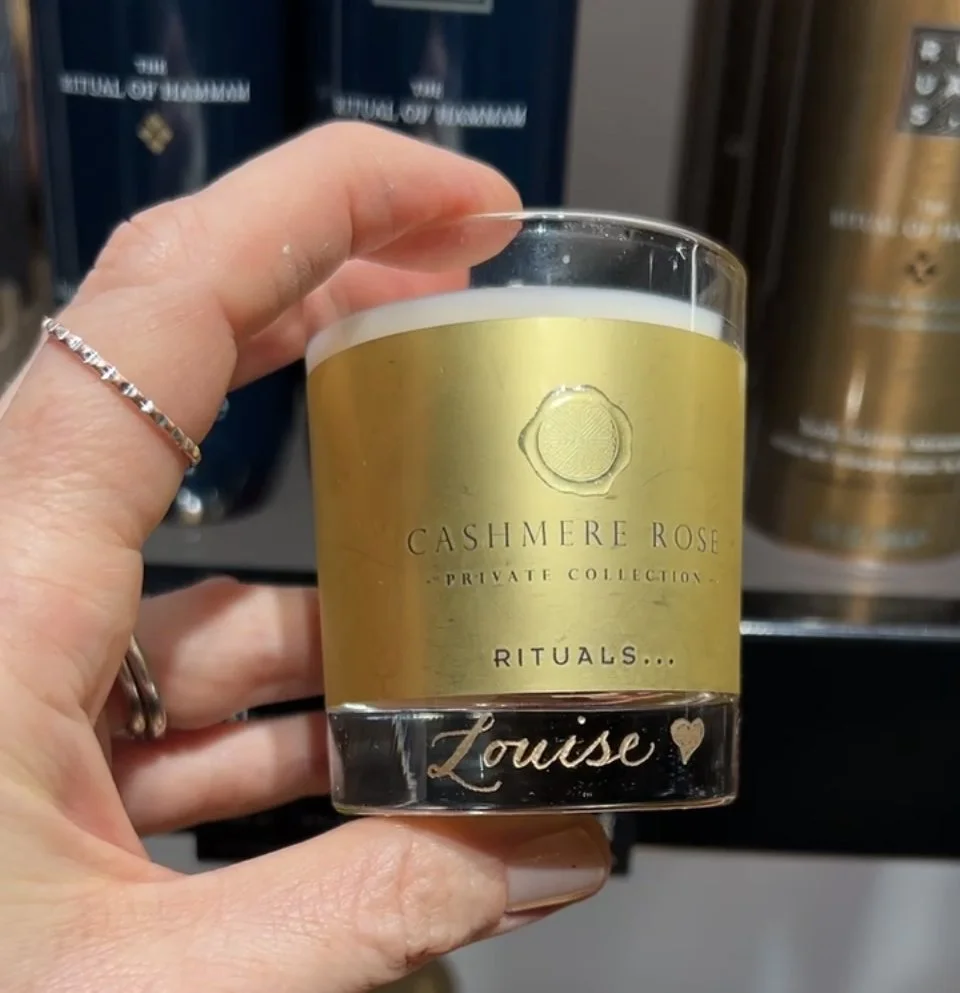 Hand engraved Rituals candle with personalised name at a live brand activation