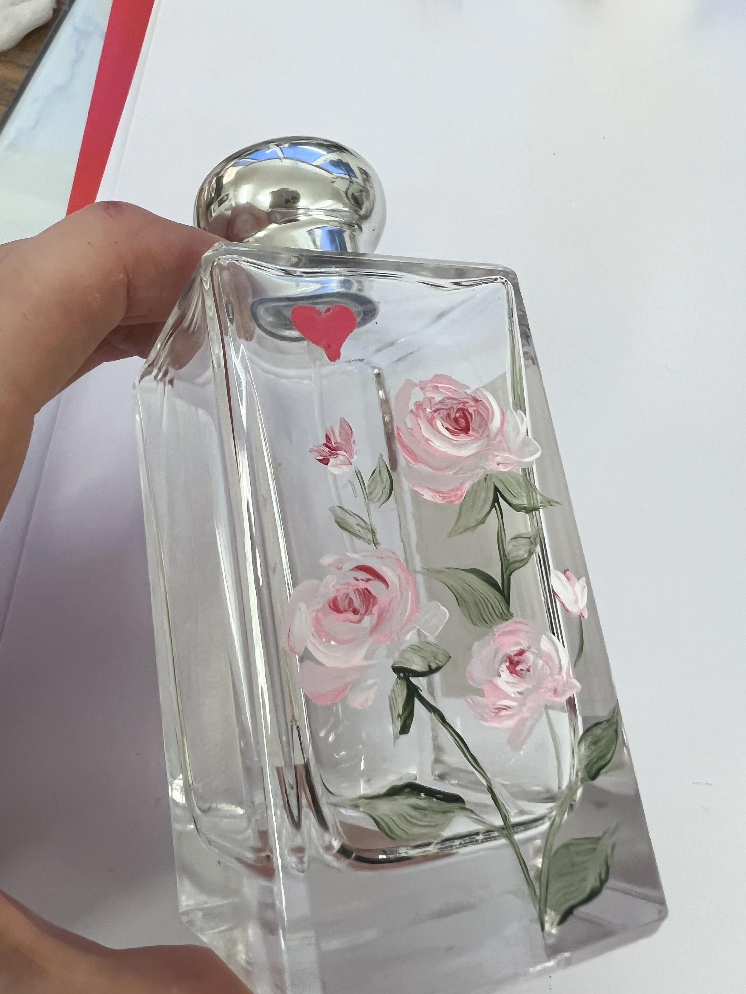 Hand painted perfume bottle with bespoke pink rose design