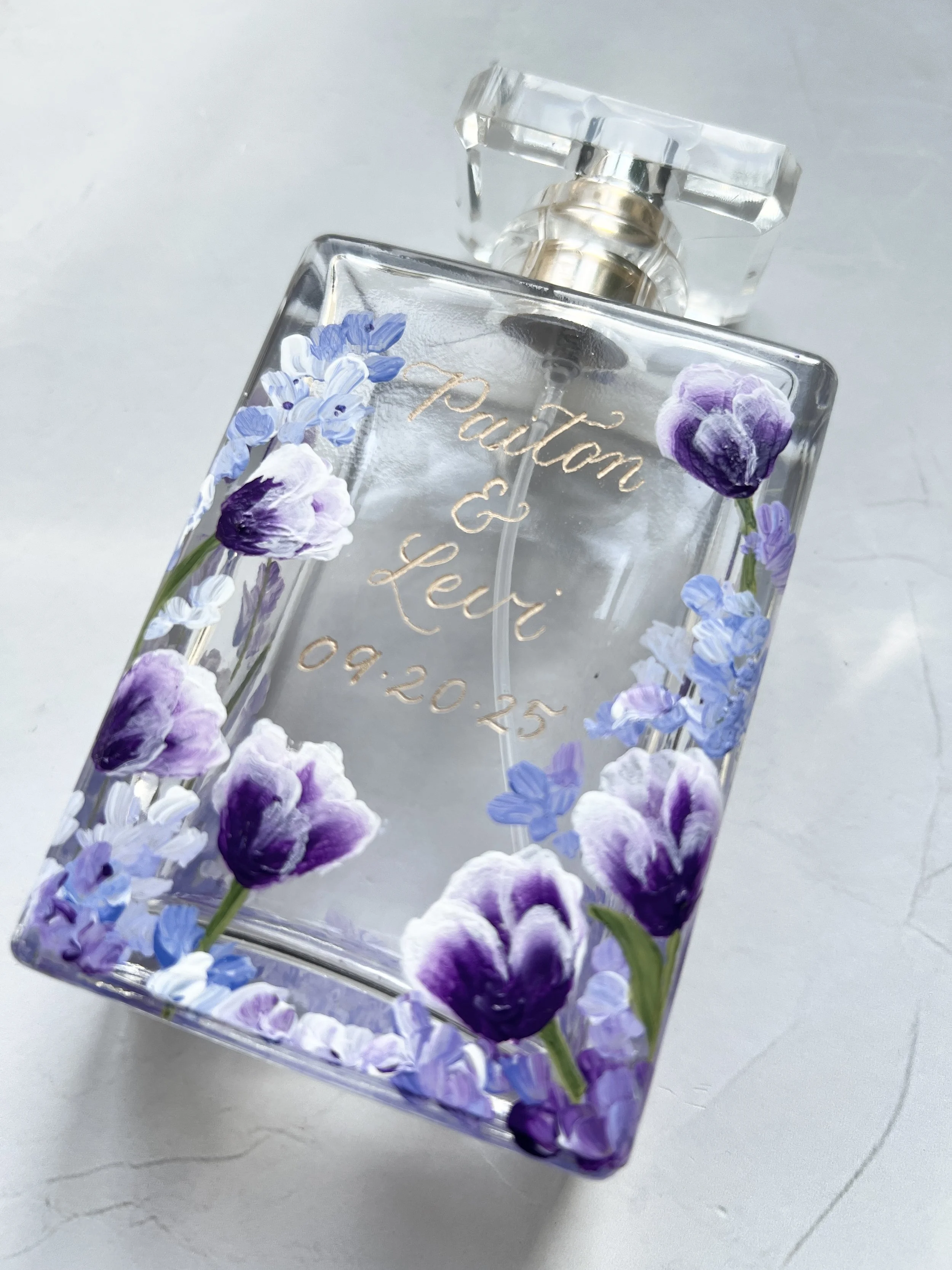Hand-painted personalised perfume bottle with purple floral tulip design and gold engraved calligraphy name and date